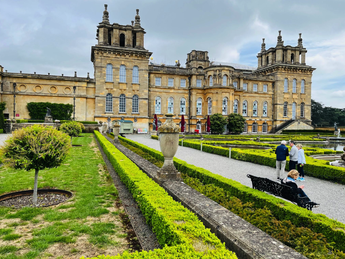 Italian Garden at Blenheim Palace, featuring formal box hedges and an ornate fountain in Woodstock, England.