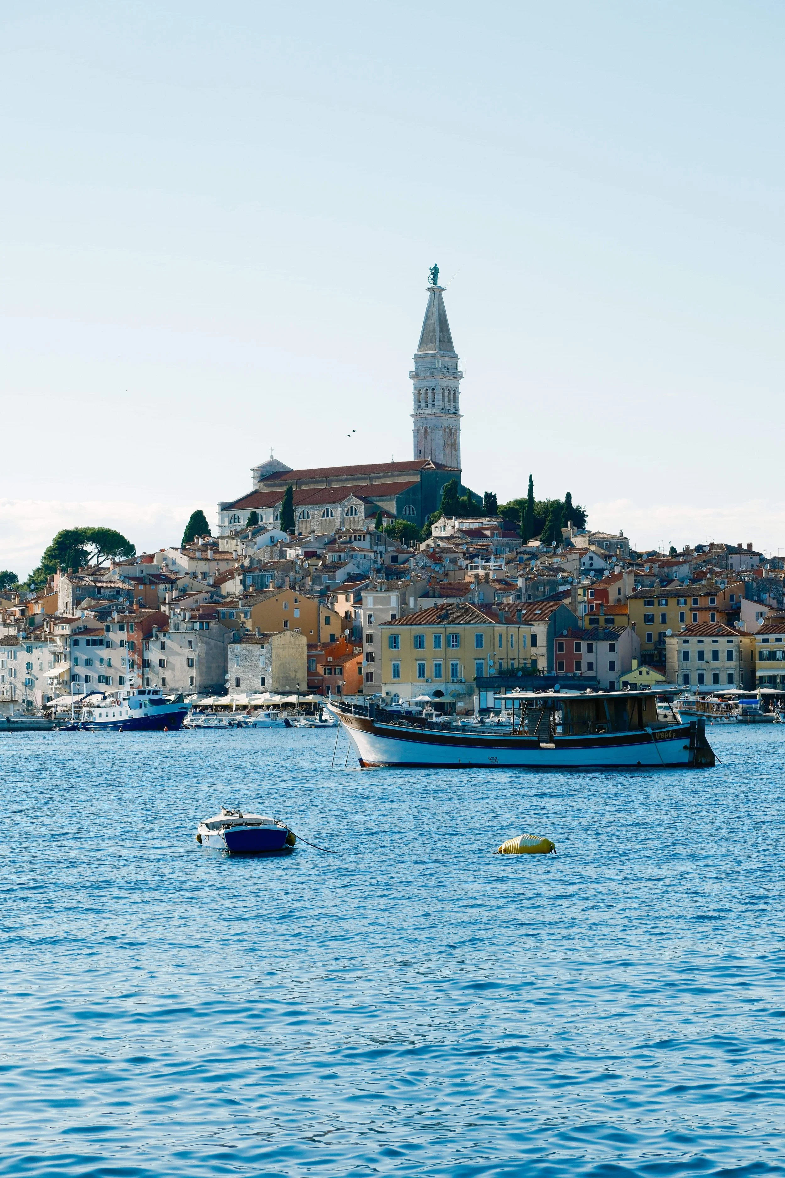 Rovinj, Istria, Croatia, a picturesque coastal town known for its colorful waterfront, historic stone buildings, and iconic Church of St. Euphemia.