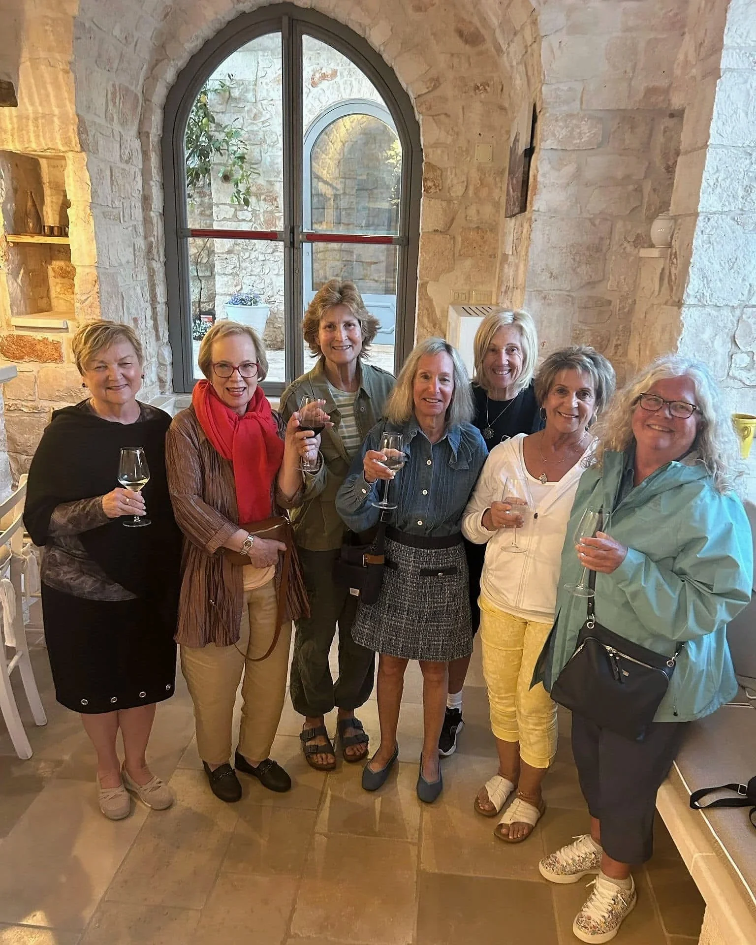 Women-only group wine tasting during a Puglia culinary tour in Southern Italy.