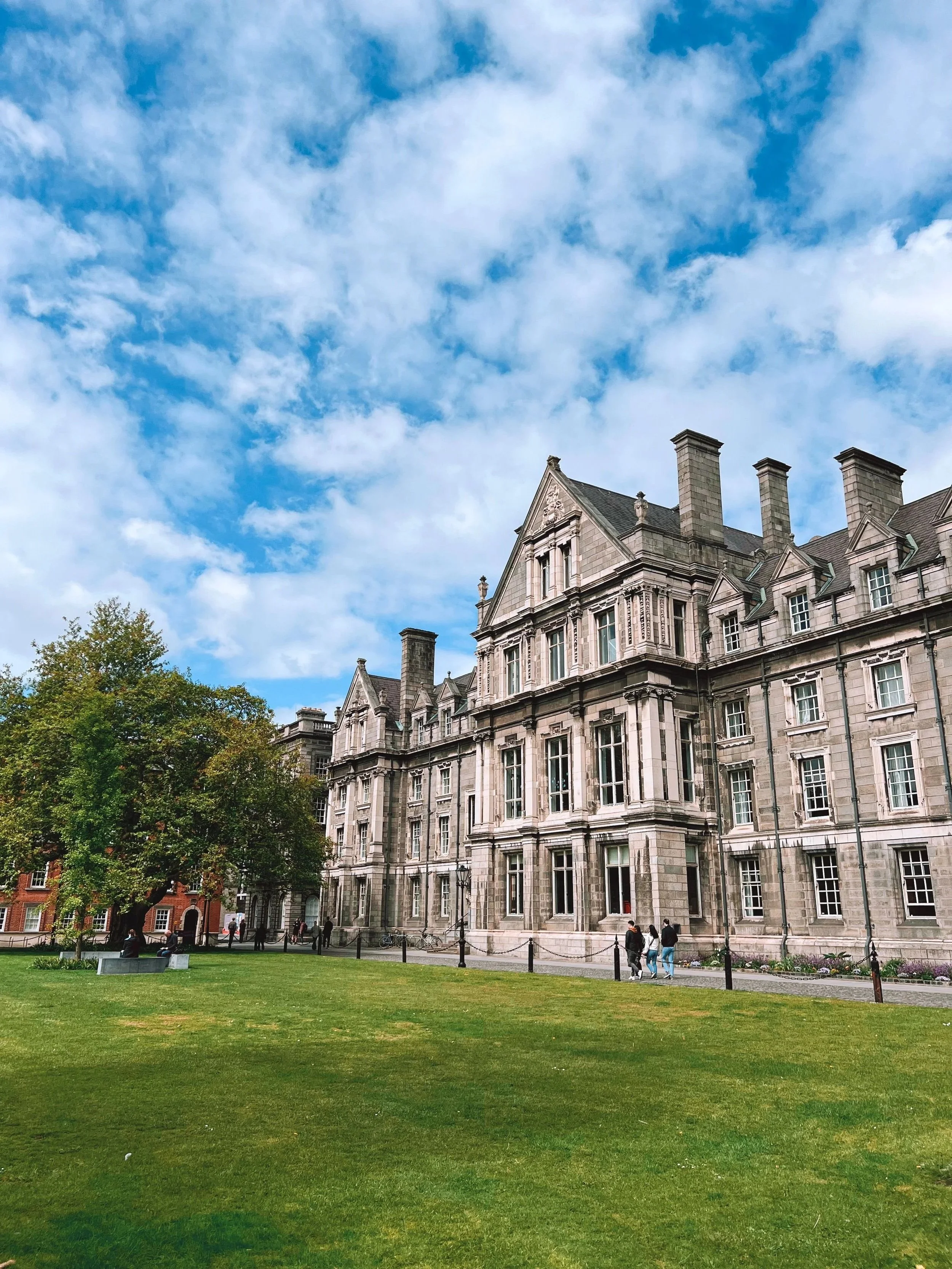 Graduates Memorial Building at Trinity College Dublin, Ireland, a historic Gothic Revival landmark facing Parliament Square, known for its distinctive stone architecture.