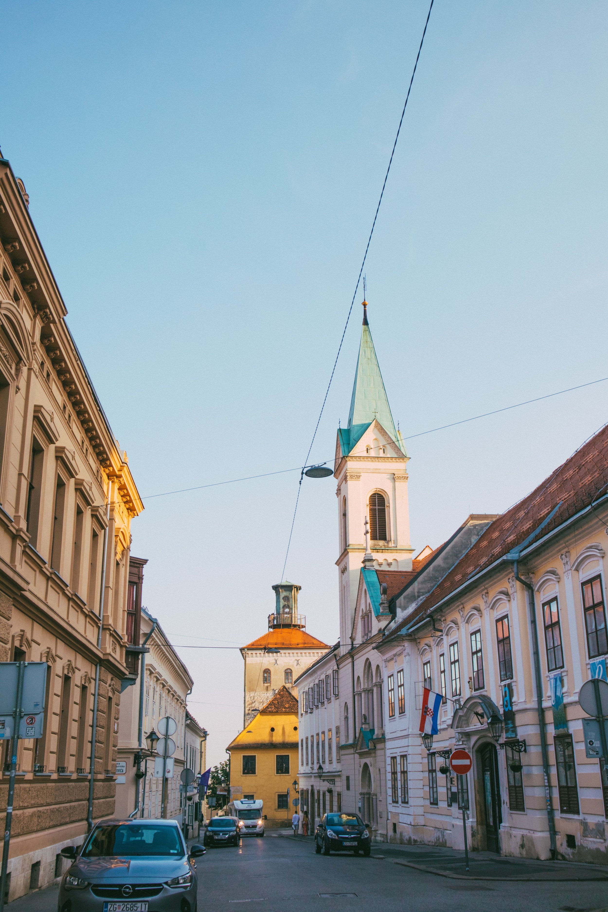 Zagreb’s Upper Town, Croatia, featuring a charming historic street lined with traditional buildings and a distinctive church tower.