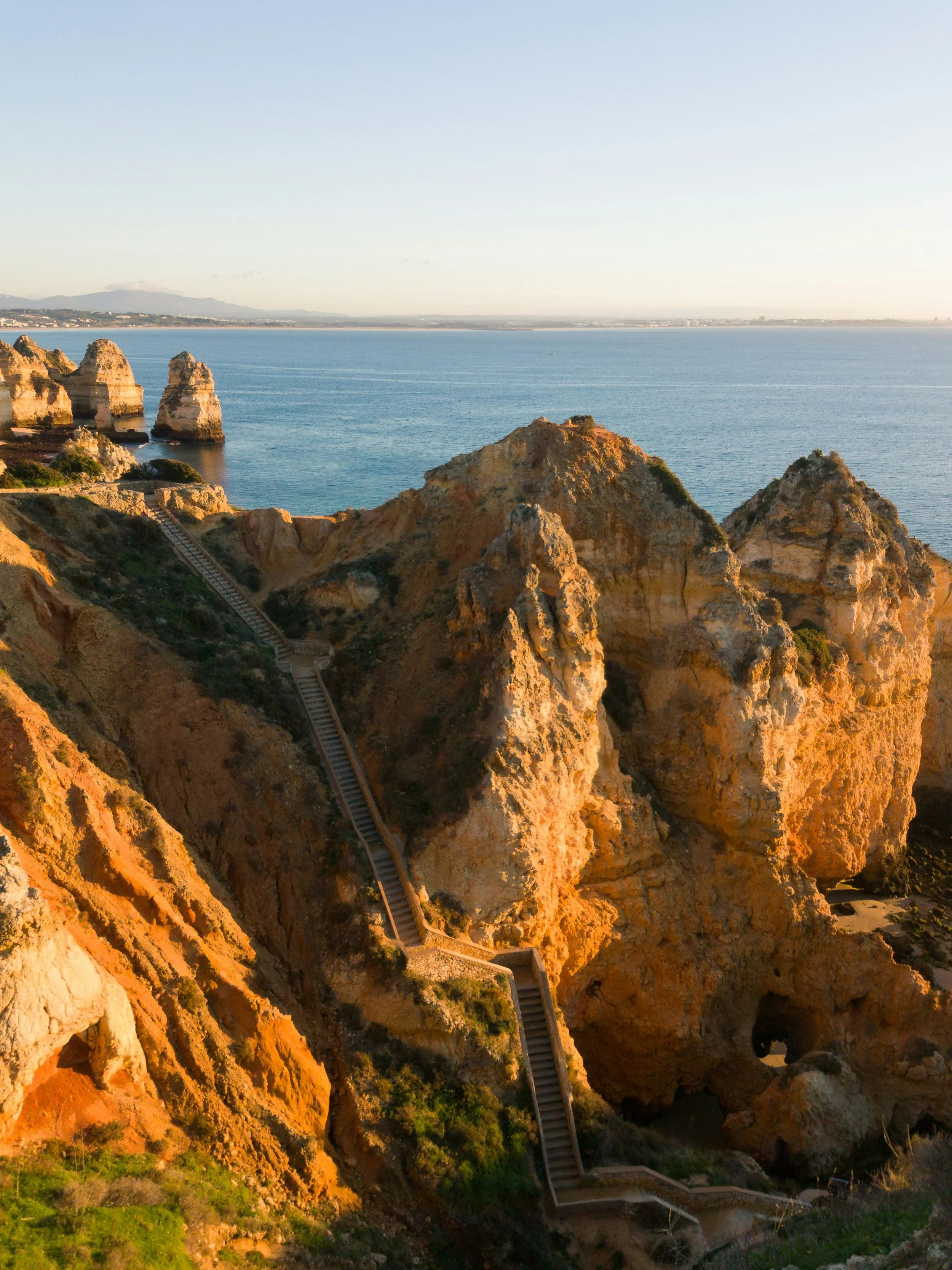 Boardwalk at Ponta da Piedade overlooking the dramatic coastline in Lagos, Portugal.