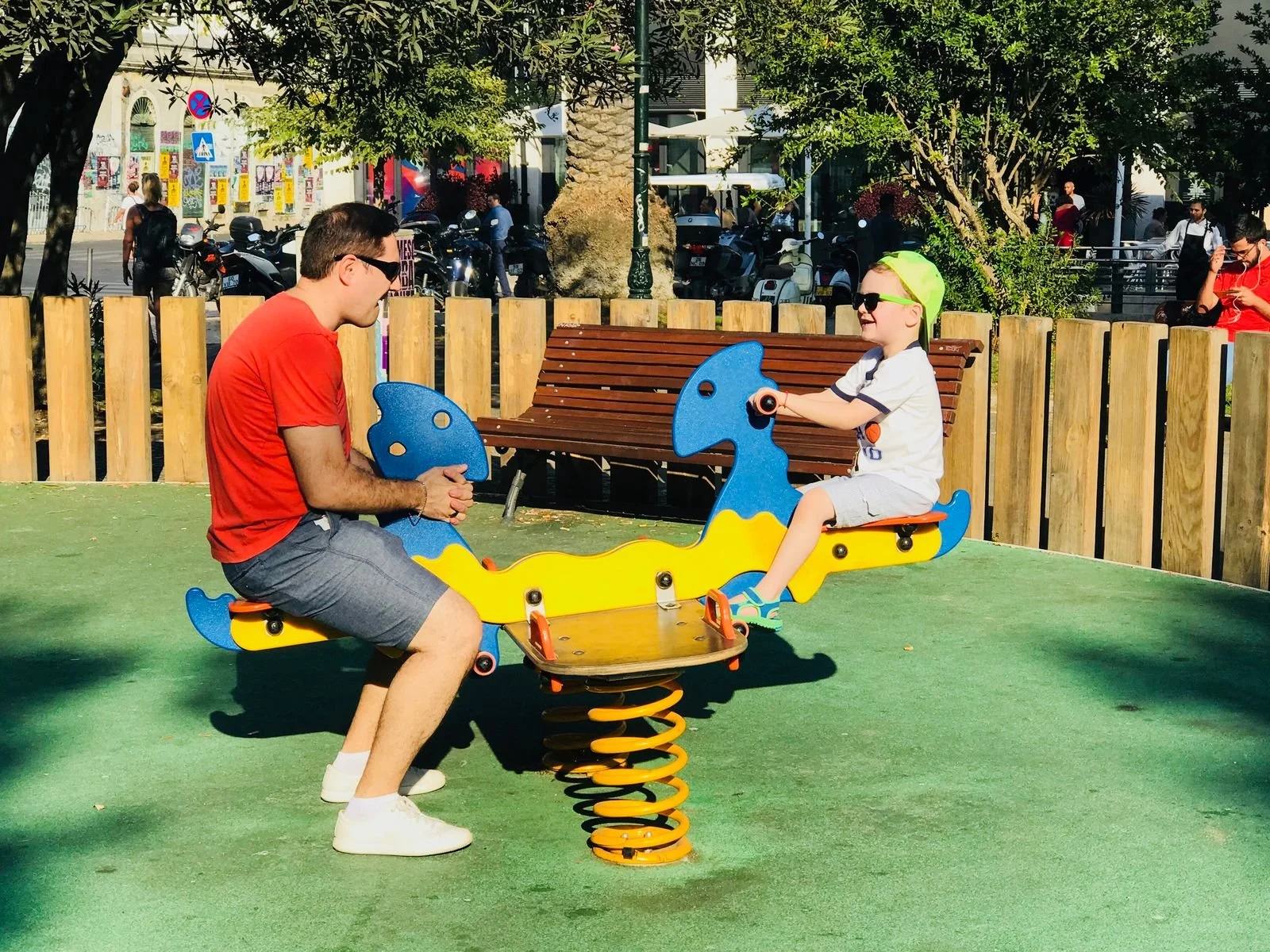 Family-friendly park in Lisbon, Portugal, with a children’s playground and shaded seating.