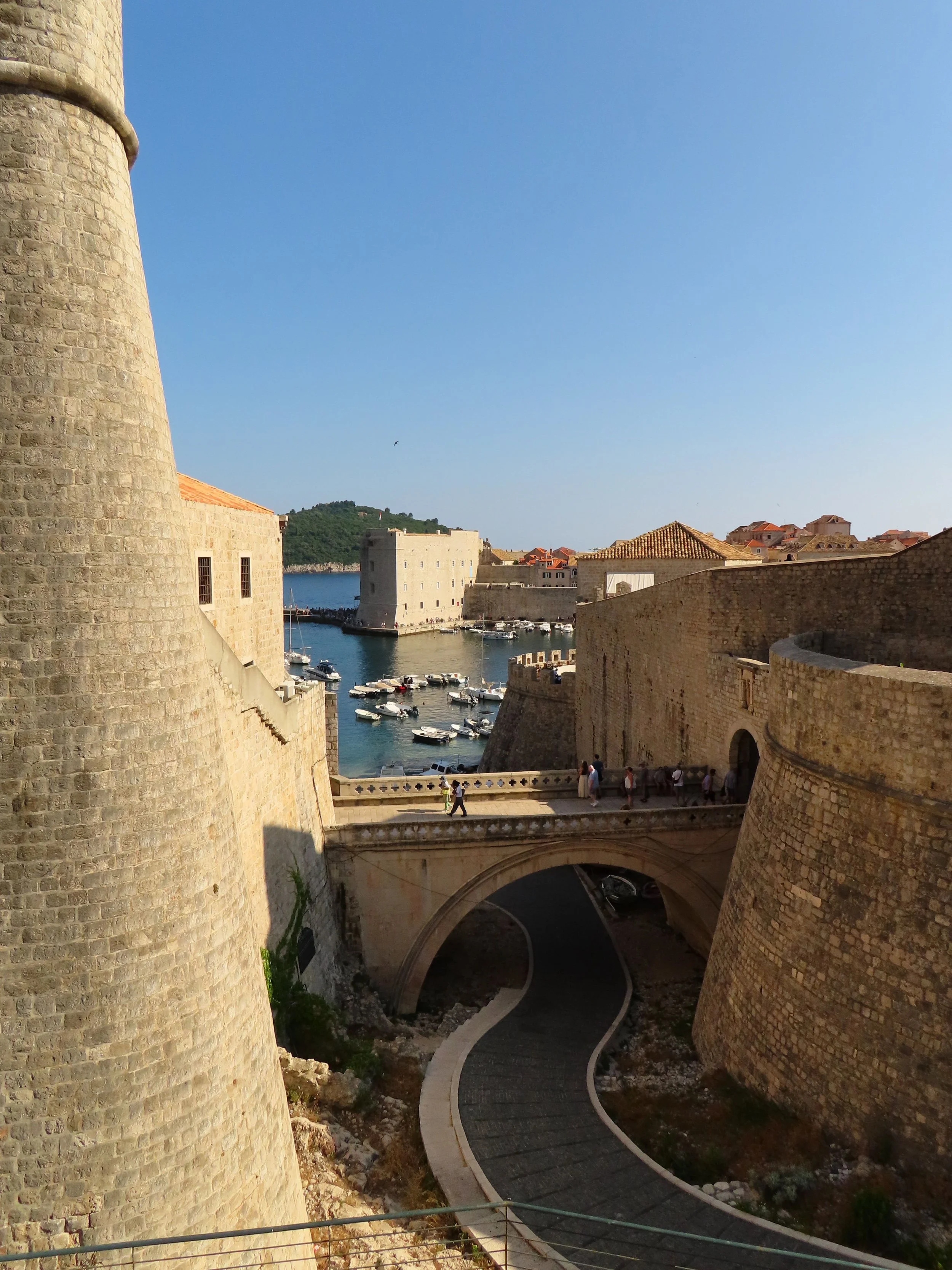 Dubrovnik’s historic city walls, Croatia, overlooking the marina and the city’s iconic stone architecture.