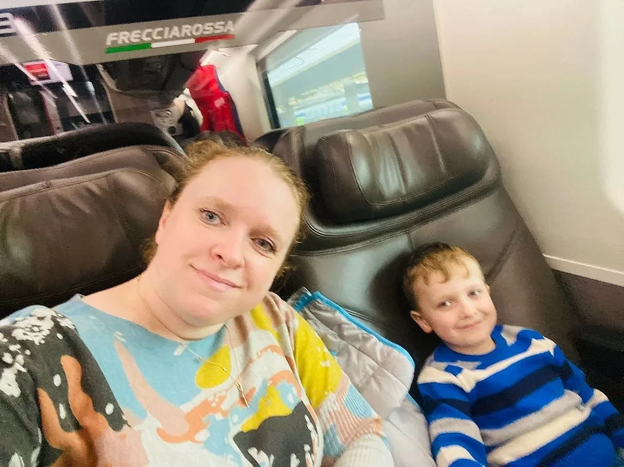 A family traveling by train with the children to their next destination.