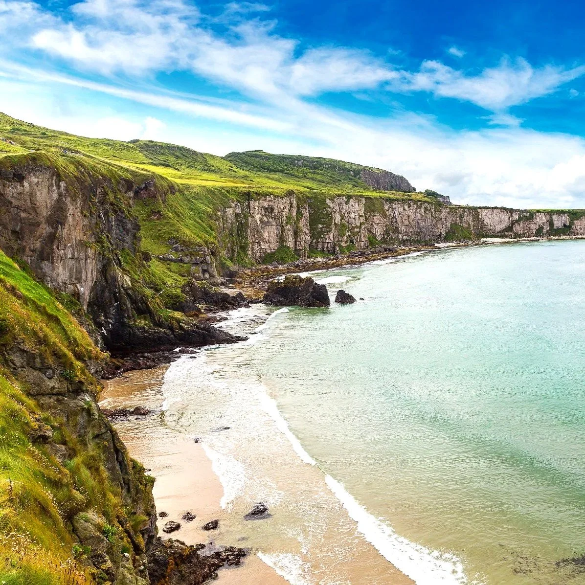 The Causeway Coast in County Antrim, Northern Ireland, known for dramatic coastal scenery and iconic landmarks such as the Giant’s Causeway and Carrick-a-Rede Rope Bridge.