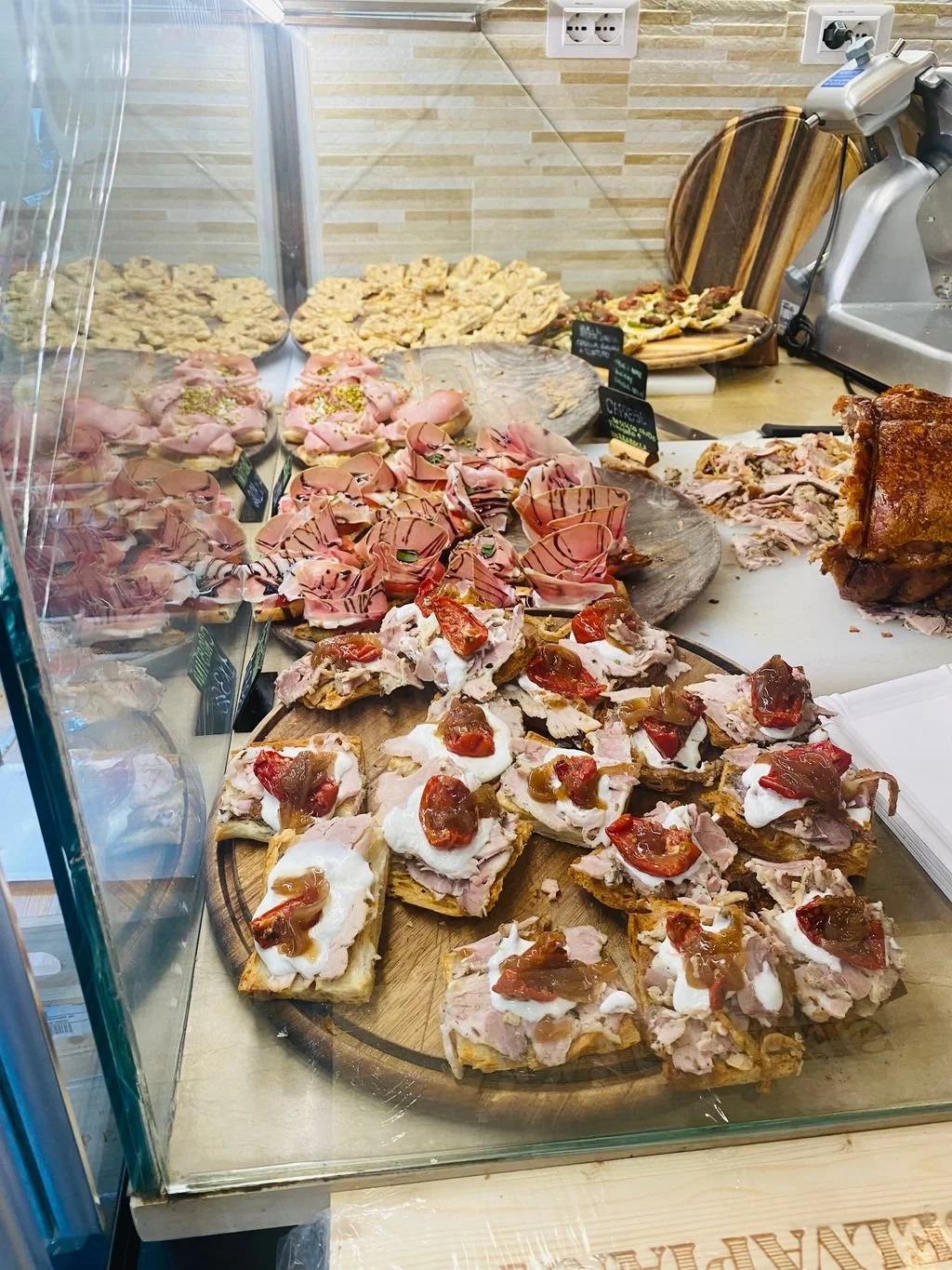 Traditional Venetian cicchetti, small open-faced toasts topped with a variety of savory ingredients.