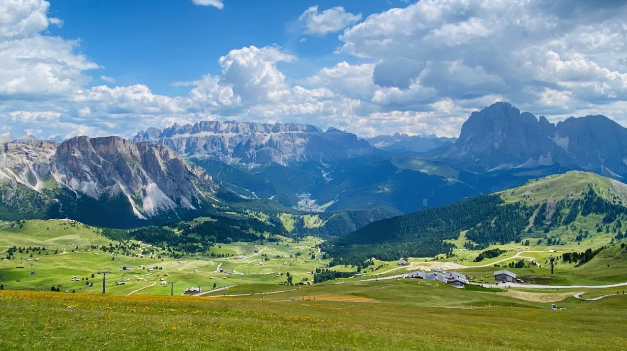 Green, empty beautiful summer ski slopes and meadows, Val Gardena, Dolomites, Italy.