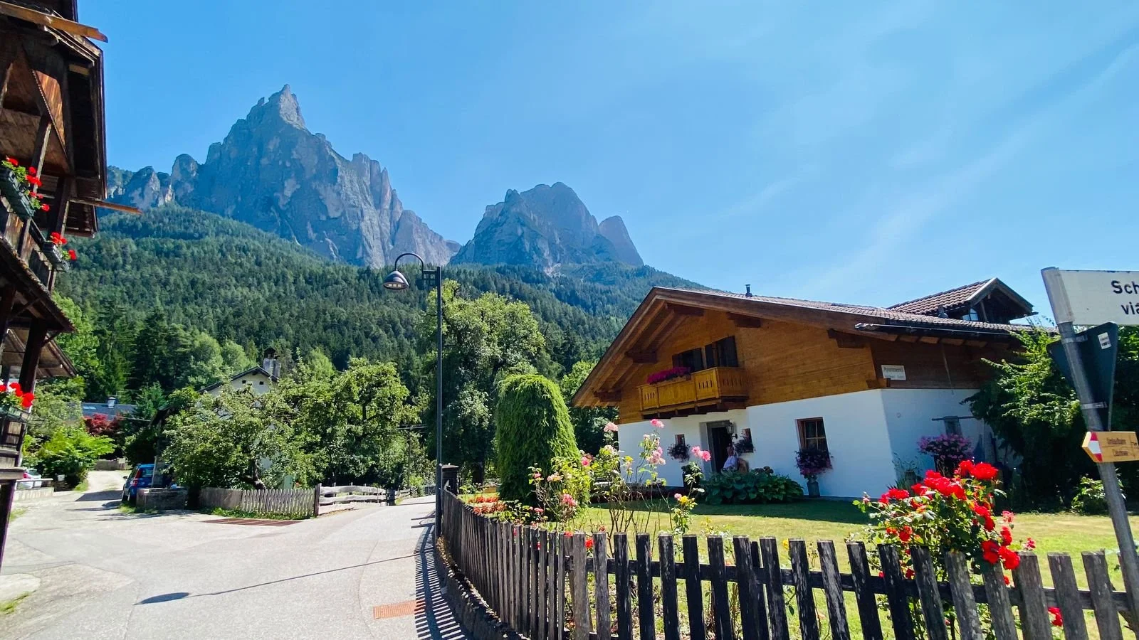 Haus Paul Fill in Siusi allo Sciliar, South Tyrol, Italy, featuring traditional alpine architecture with the dramatic Sciliar massif rising in the background.