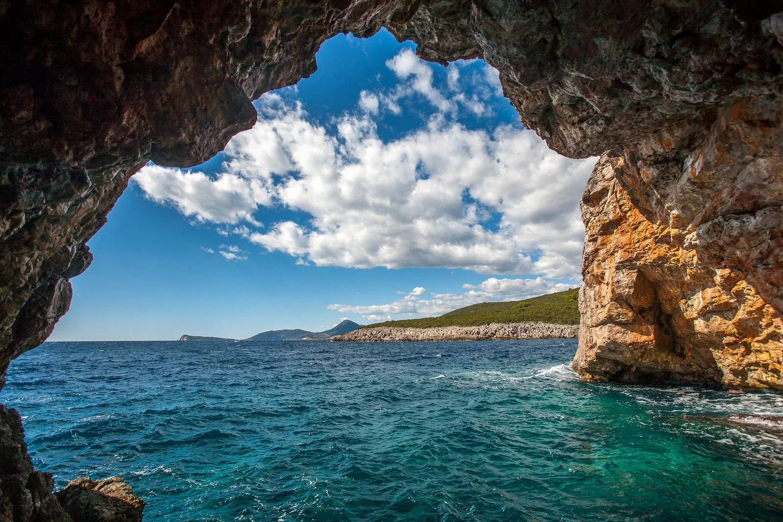 Blue Cave (Plava Špilja), a sea cave on Montenegro’s Luštica Peninsula known for its glowing blue waters.