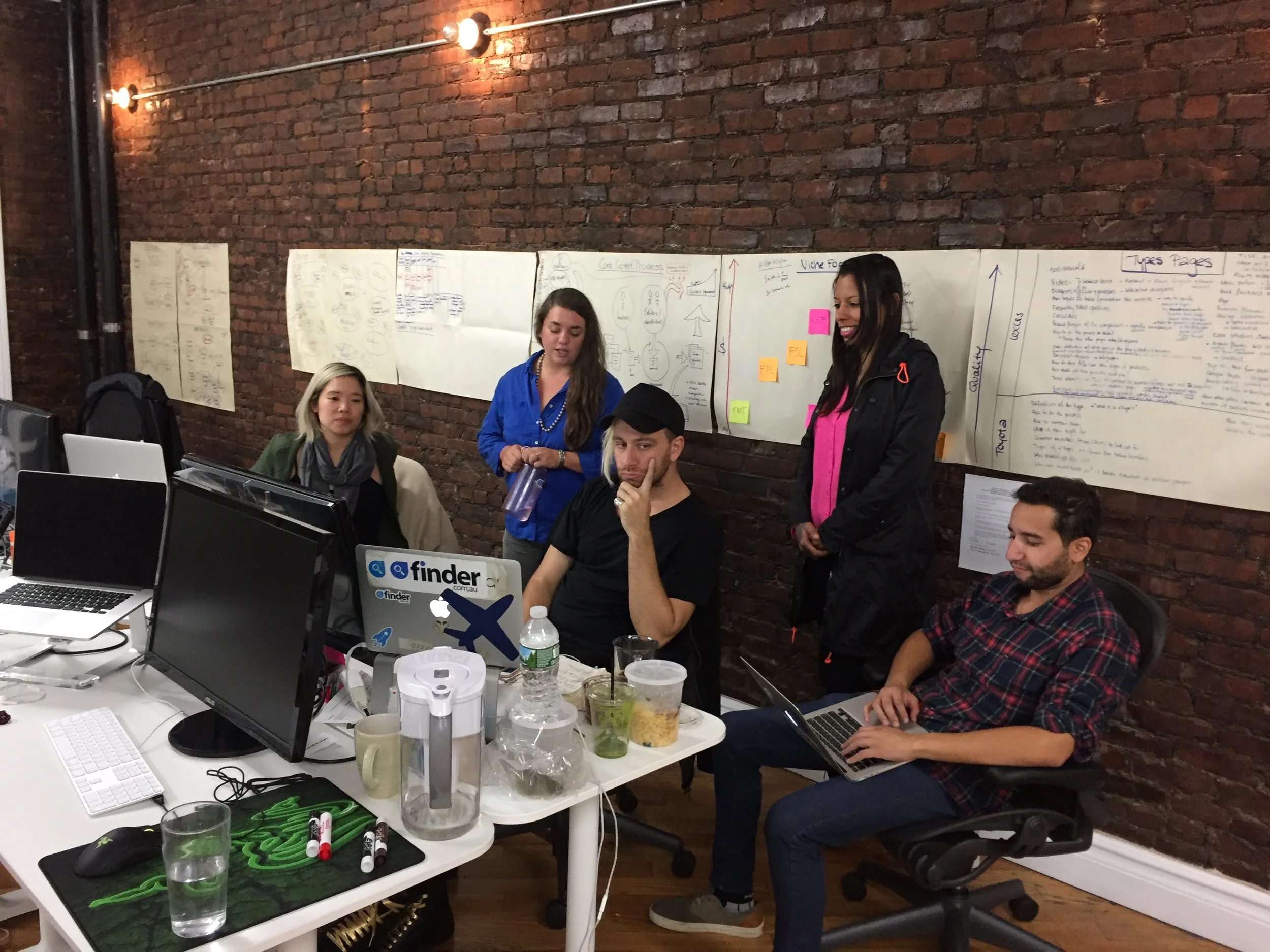 Team of 4 behind Fred Schebesta as we hold one of our first All-hands