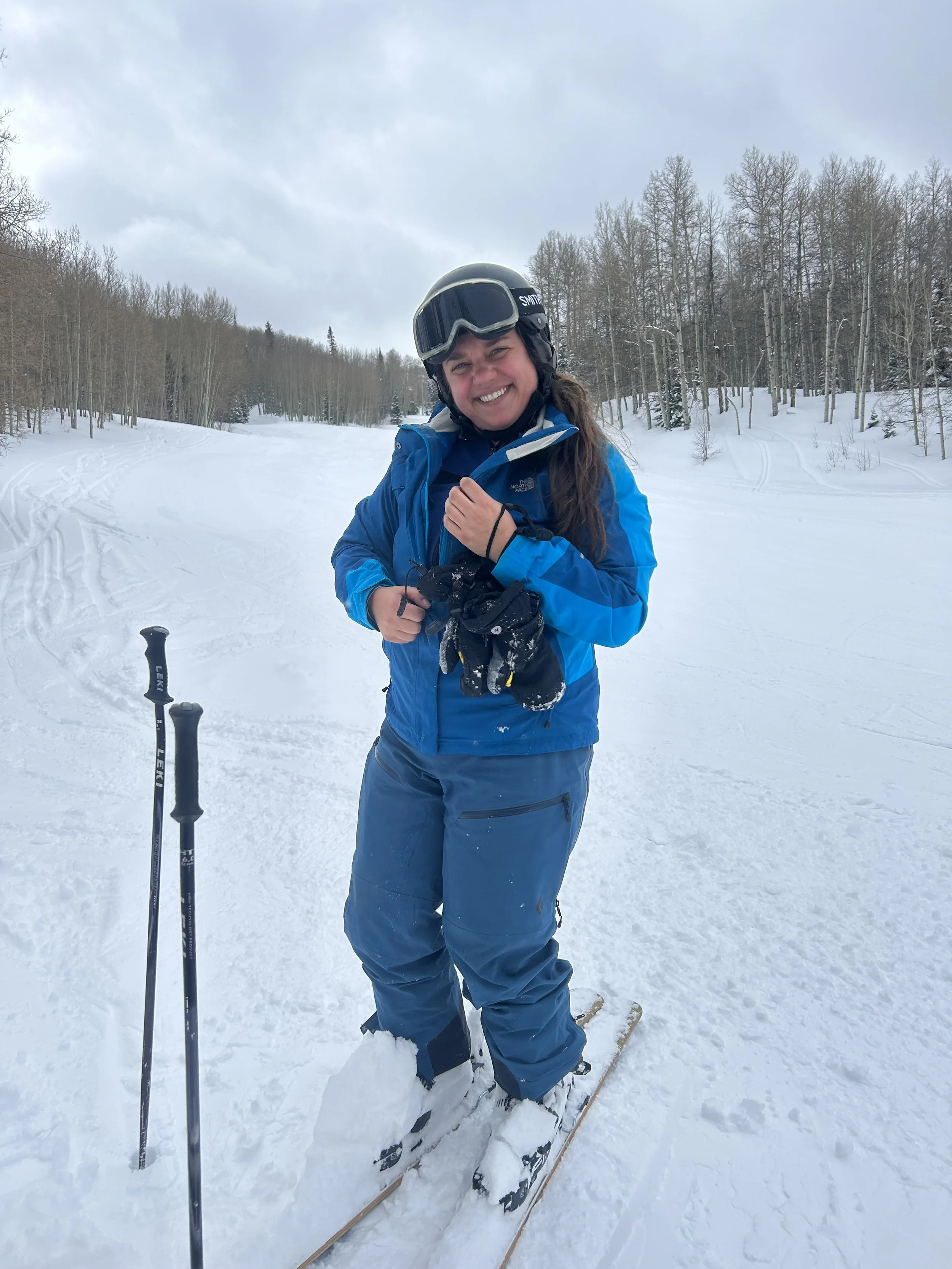 Adrienne Kmetz is an SEO expert living in the Roaring Fork Valley. She is skiing Sunlight Peak here in a blue getup - always wear your helmet!