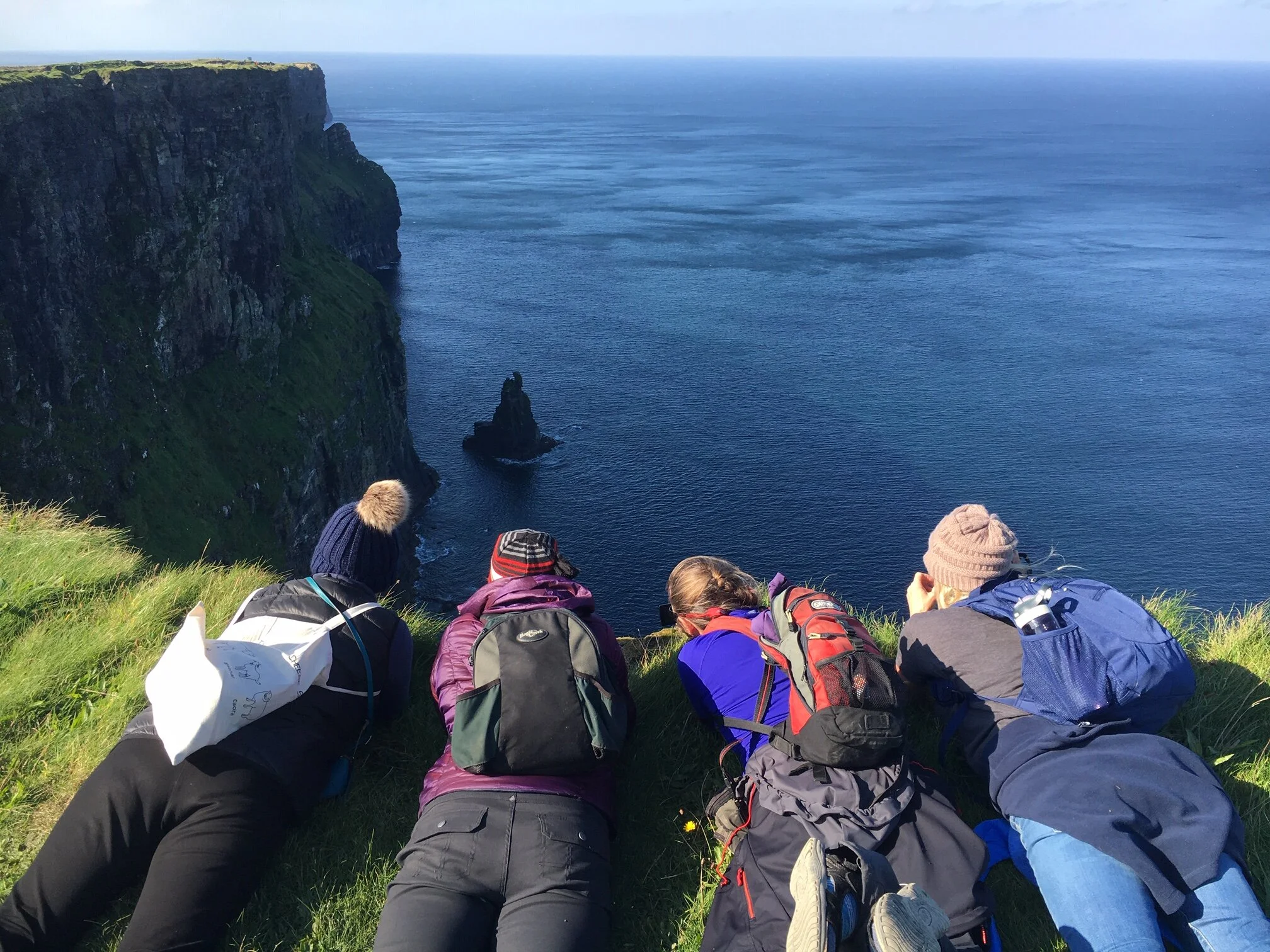 Peeking down the Cliff’s of Moher with our new buddies!