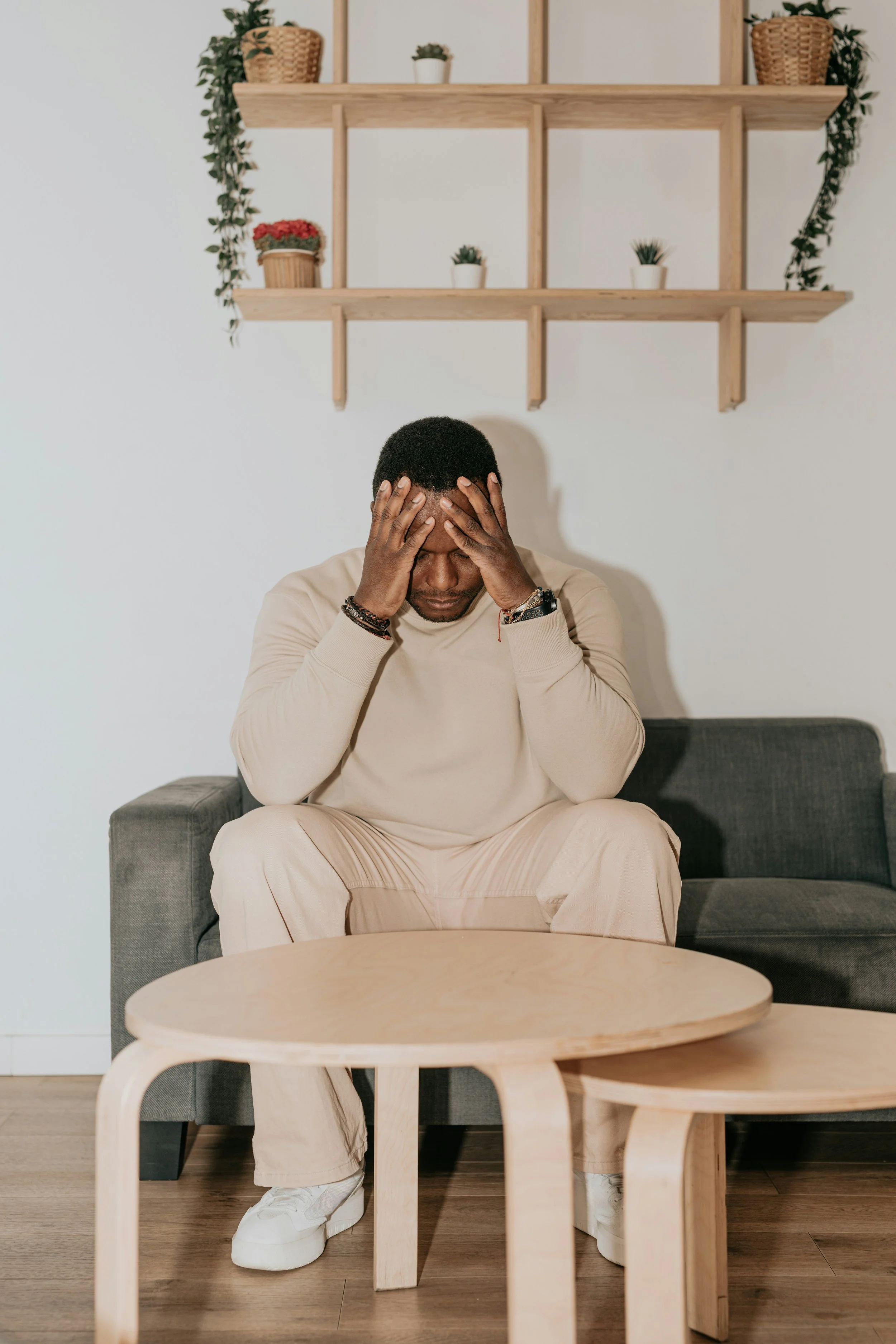 Photo of anxious man with his hands on his forehead