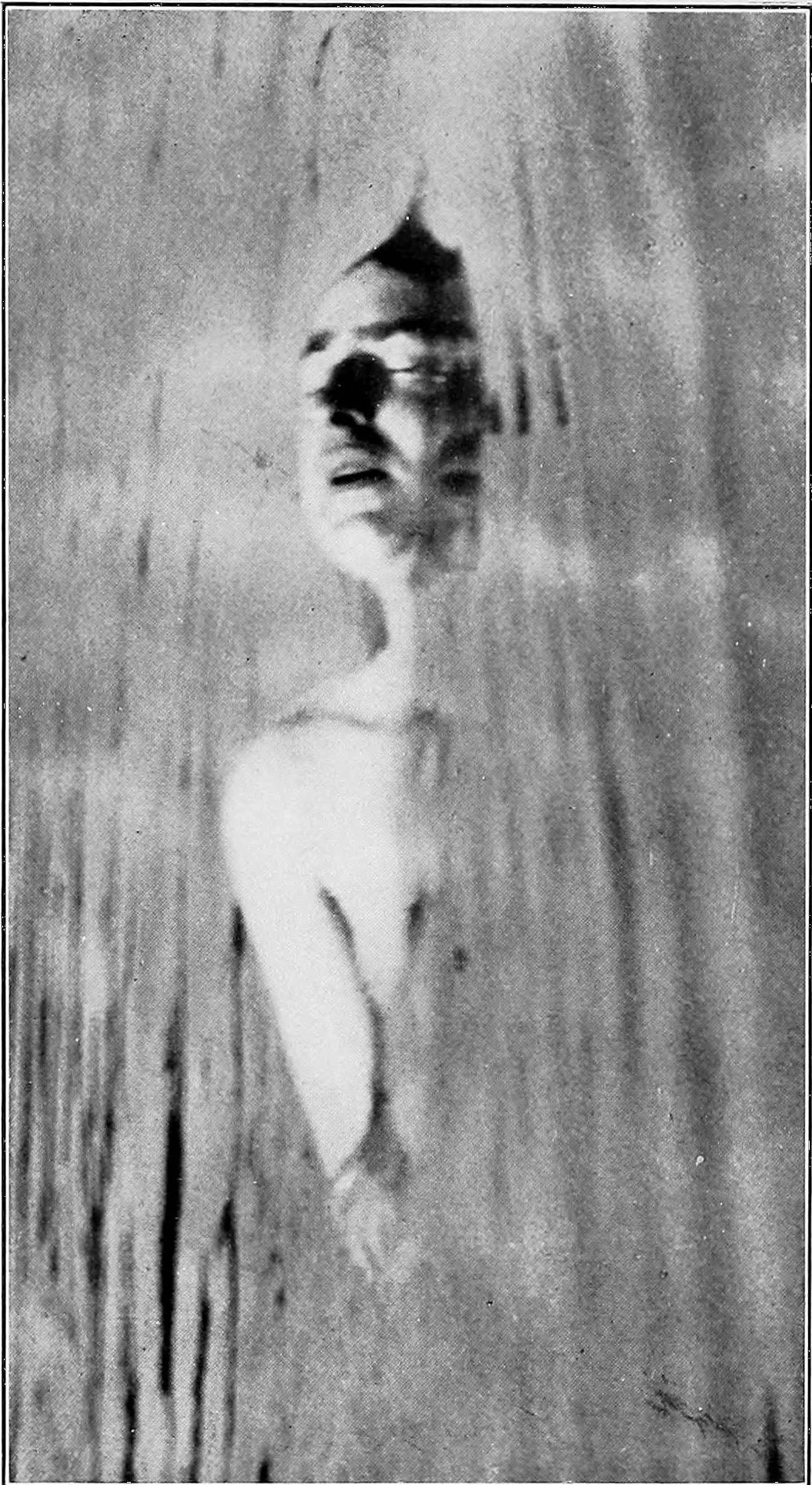 Black and white image of Jennie June floating in water.