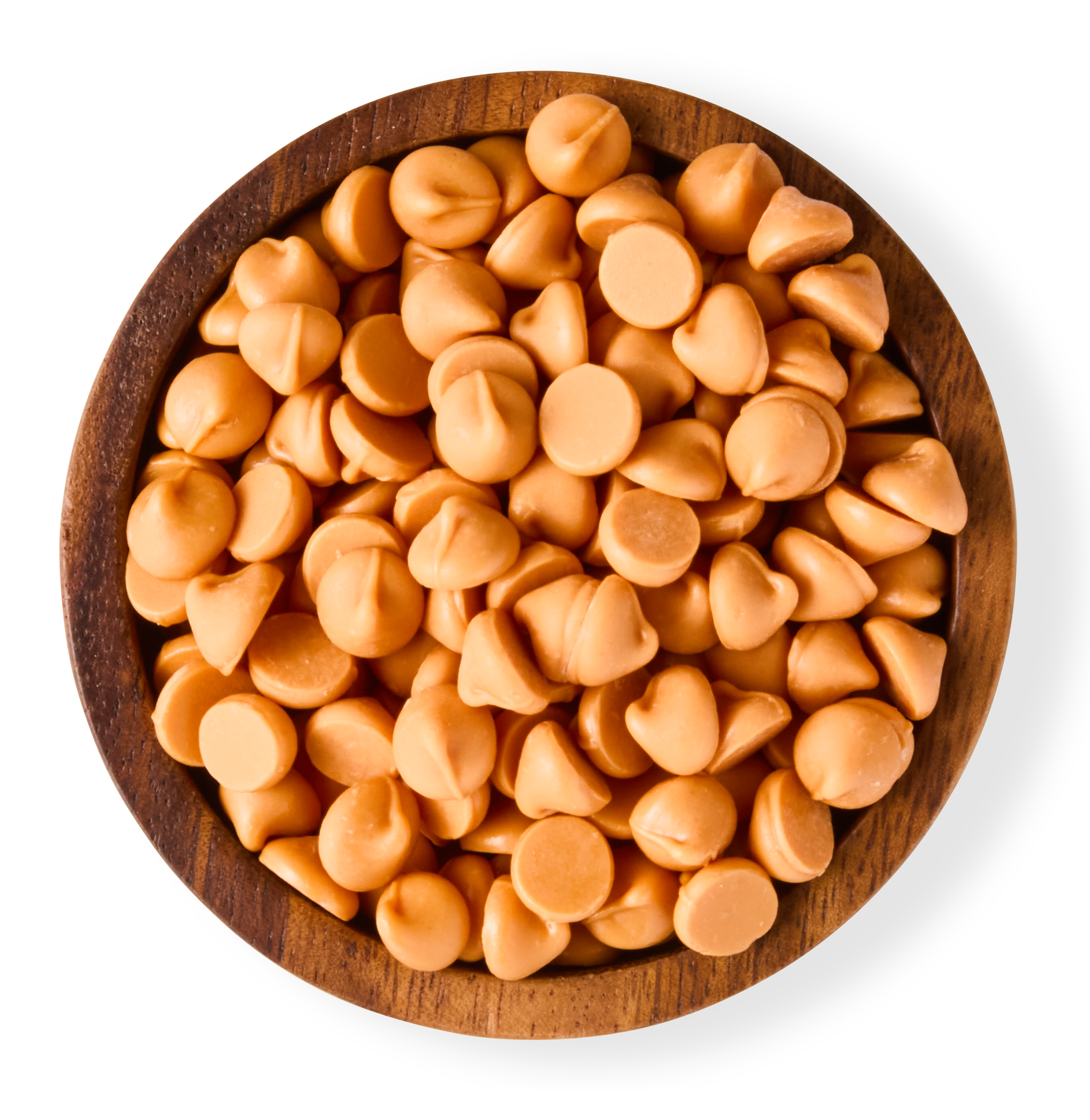 A wooden bowl filled with caramel chips