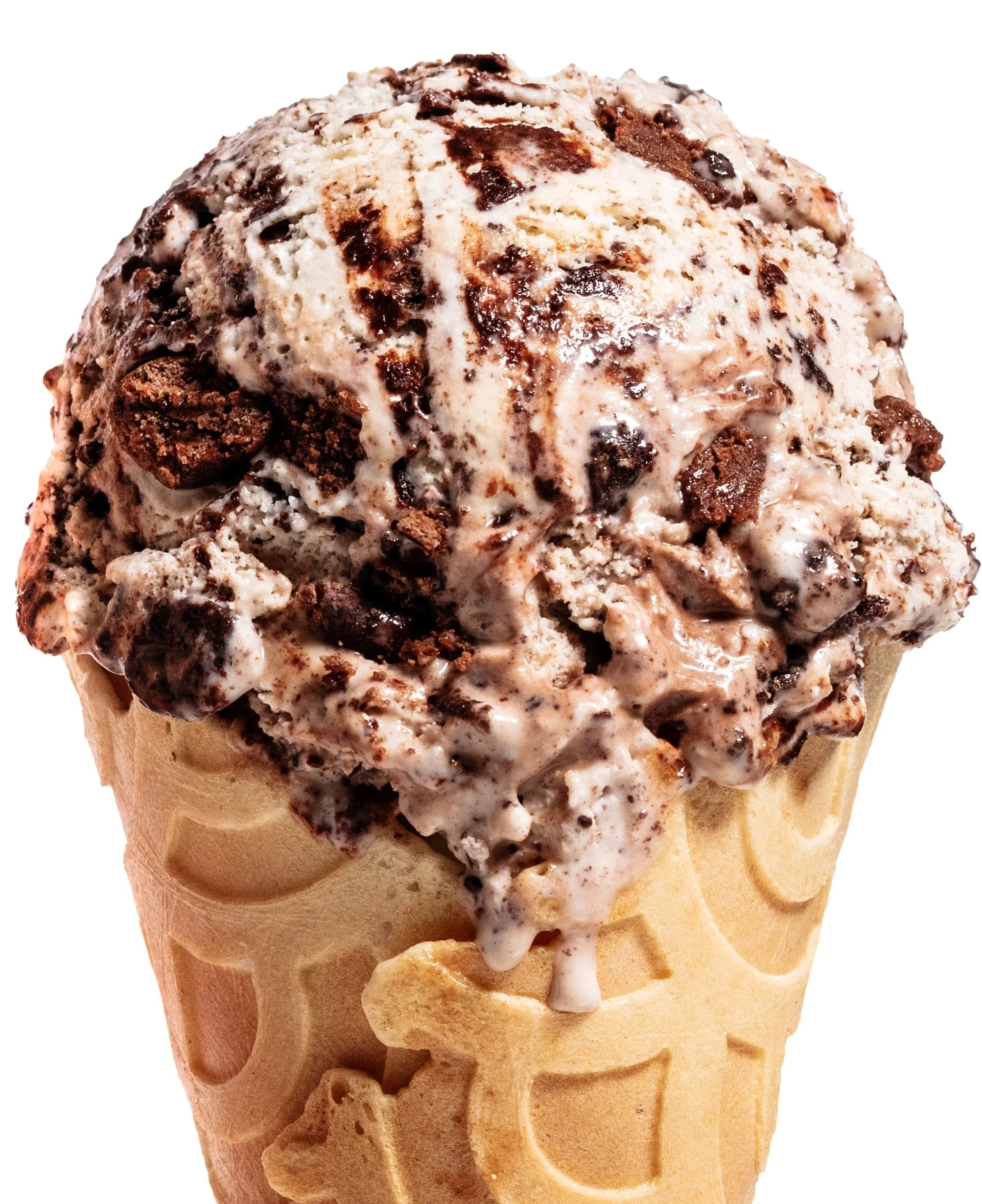 Ice cream scoop with chocolate bits in a waffle cone