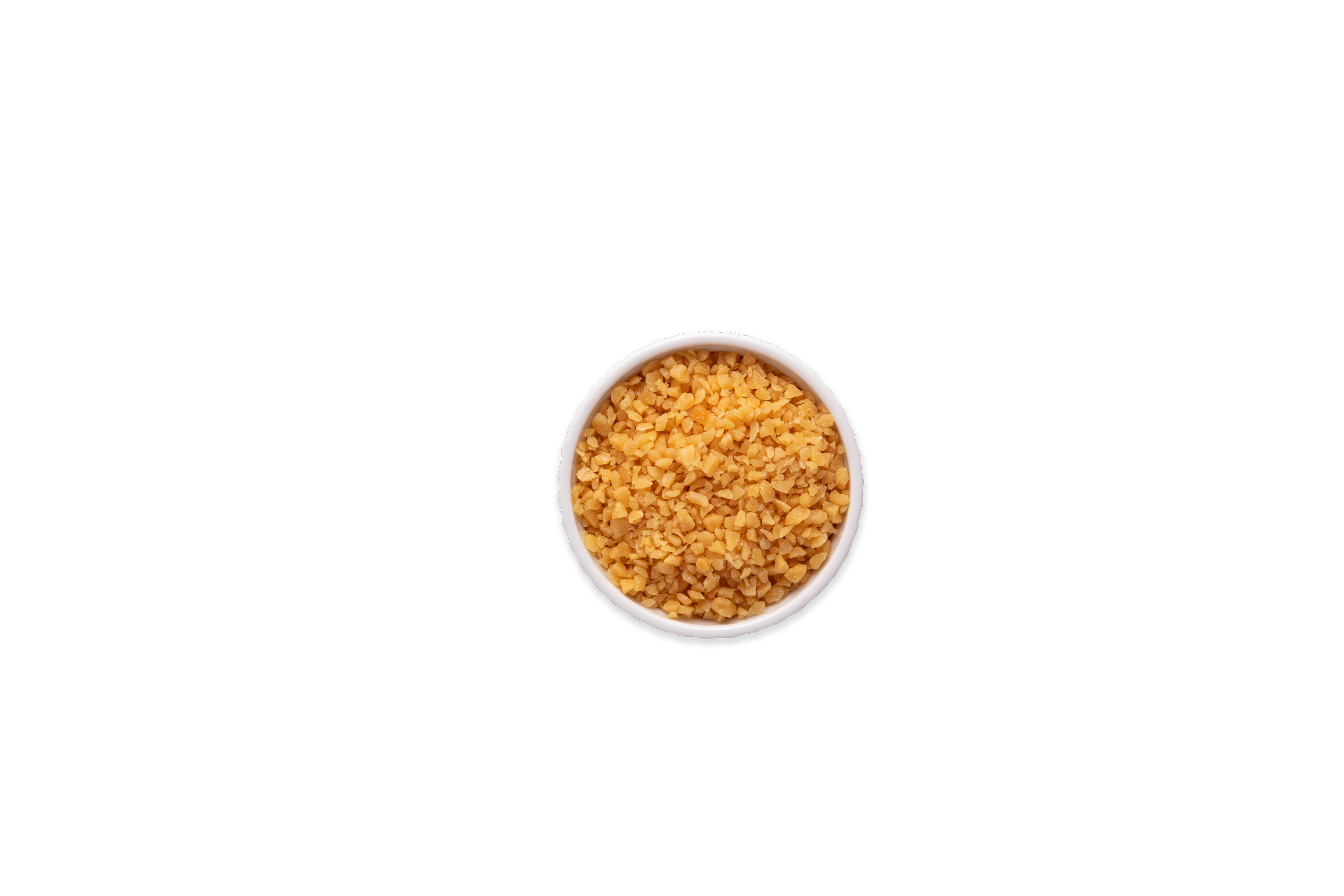 Top-down view of a small white bowl filled with toffee bits