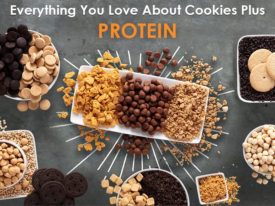 A variety of cookie ingredients arranged on a gray surface, including chocolate chips, cookie dough chunks, crushed cookies, and other baking supplies, with the text 'Everything You Love About Cookies Plus PROTEIN' at the top.