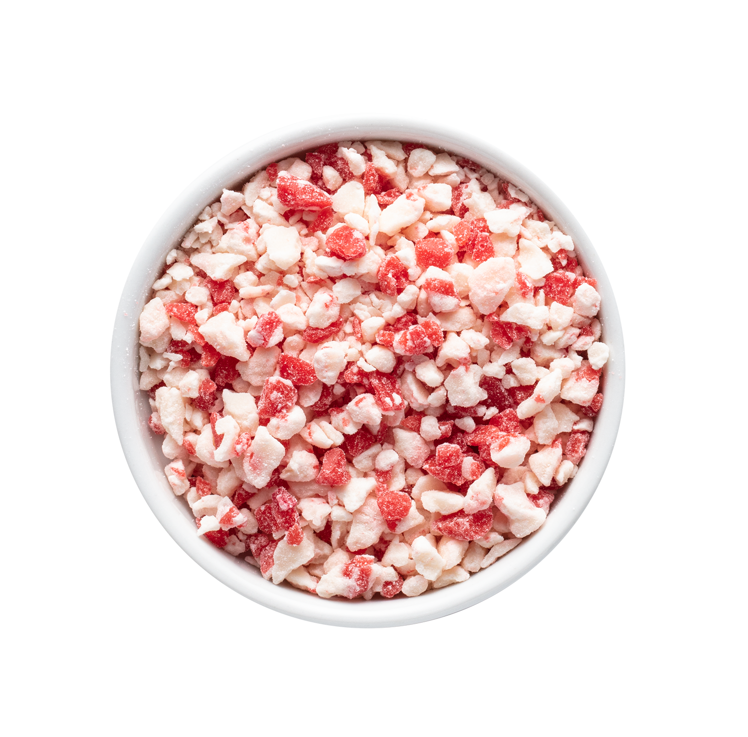 Close-up of a white bowl filled with crushed peppermint candy pieces, including red and white bits.