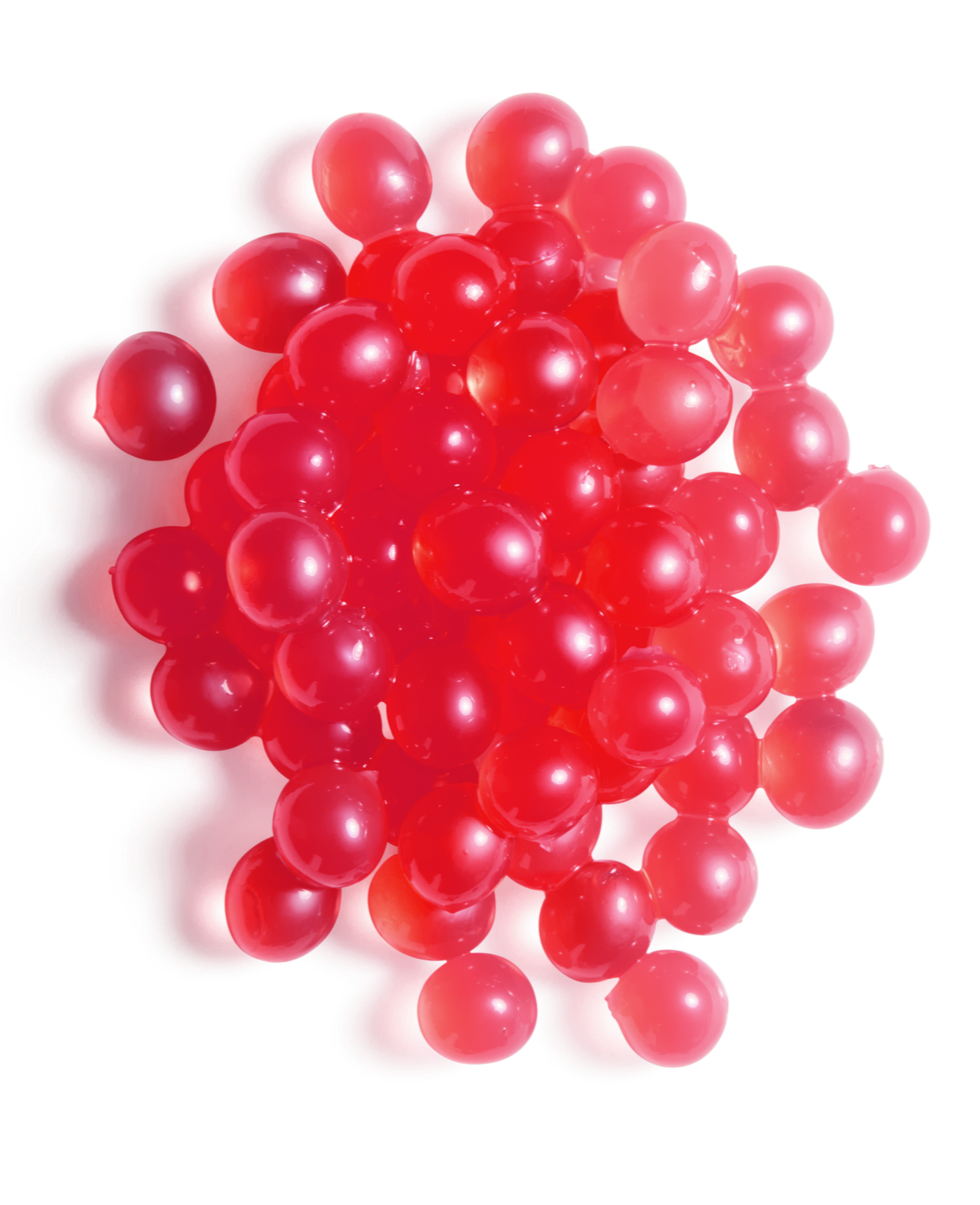 Close-up of a cluster of shiny red popping boba pearls.