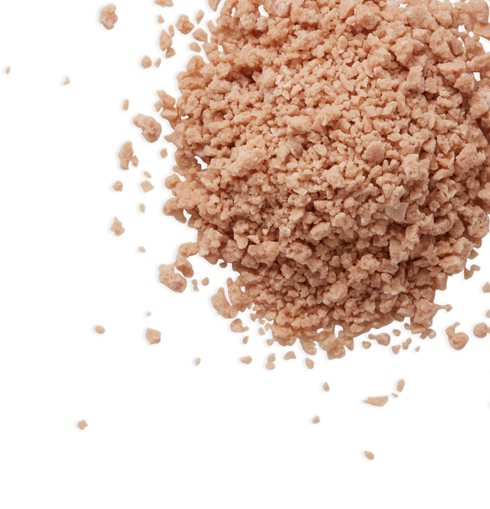 Close-up of ground meat, with labeled parts indicating various components.