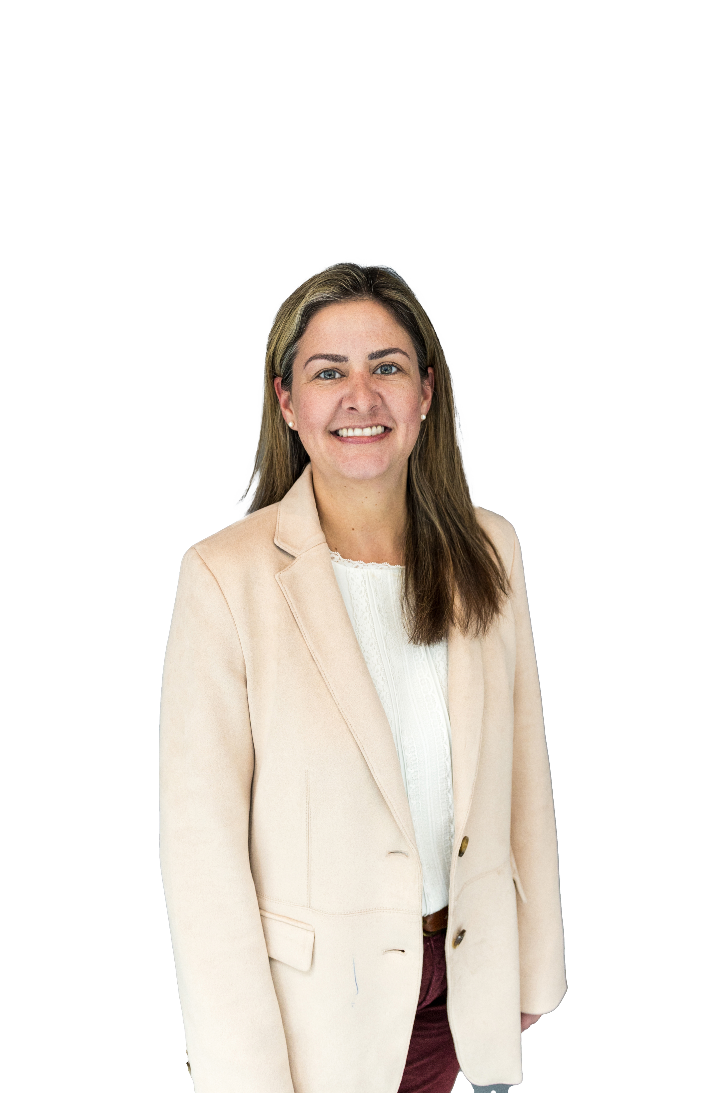 A woman with light brown hair wearing a beige blazer and white blouse, standing against a background with black, white, and green parts.
