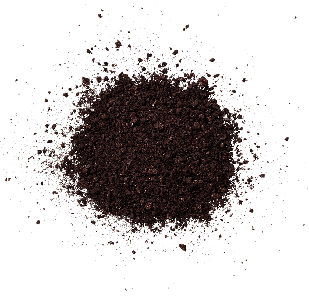A pile of dark brown crushed coffee beans on a black background.