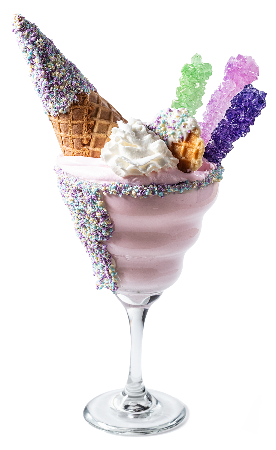 A glass filled with pink ice cream topped with whipped cream, colorful sprinkles, and surrounded by a waffle cone and four sugar crystals in pastel colors.