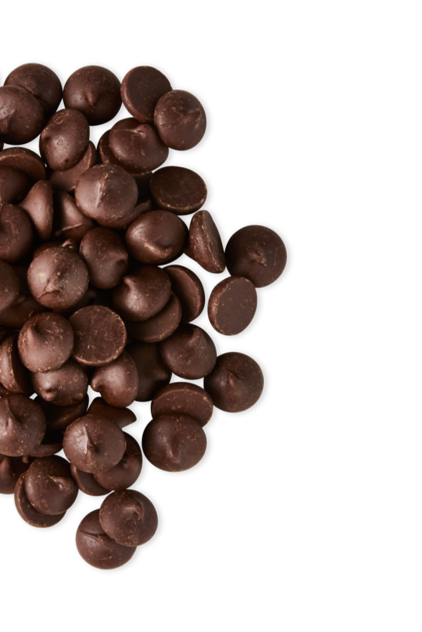 Close-up of scattered dark chocolate chips against a black background.