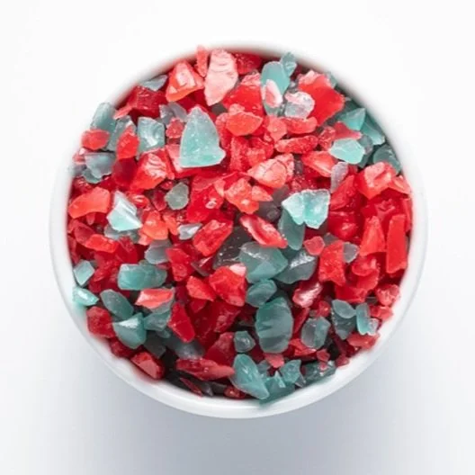 A white bowl filled with Red and Green Mint Flakes