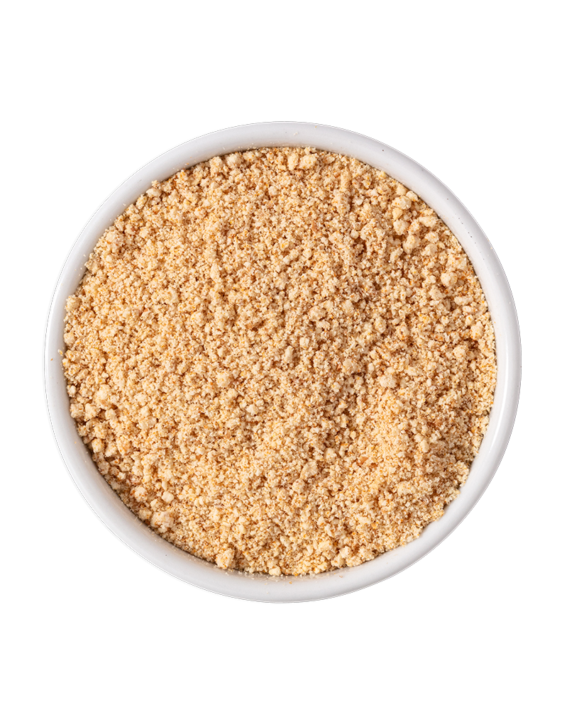 A bowl of ground peanuts on a black background.