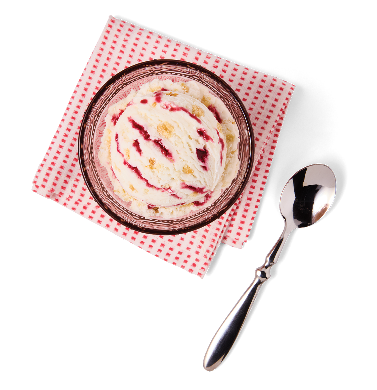 A bowl of vanilla ice cream with berry sauce swirls, placed on a paper napkin with a red check pattern, accompanied by a shiny metal spoon on a black background.