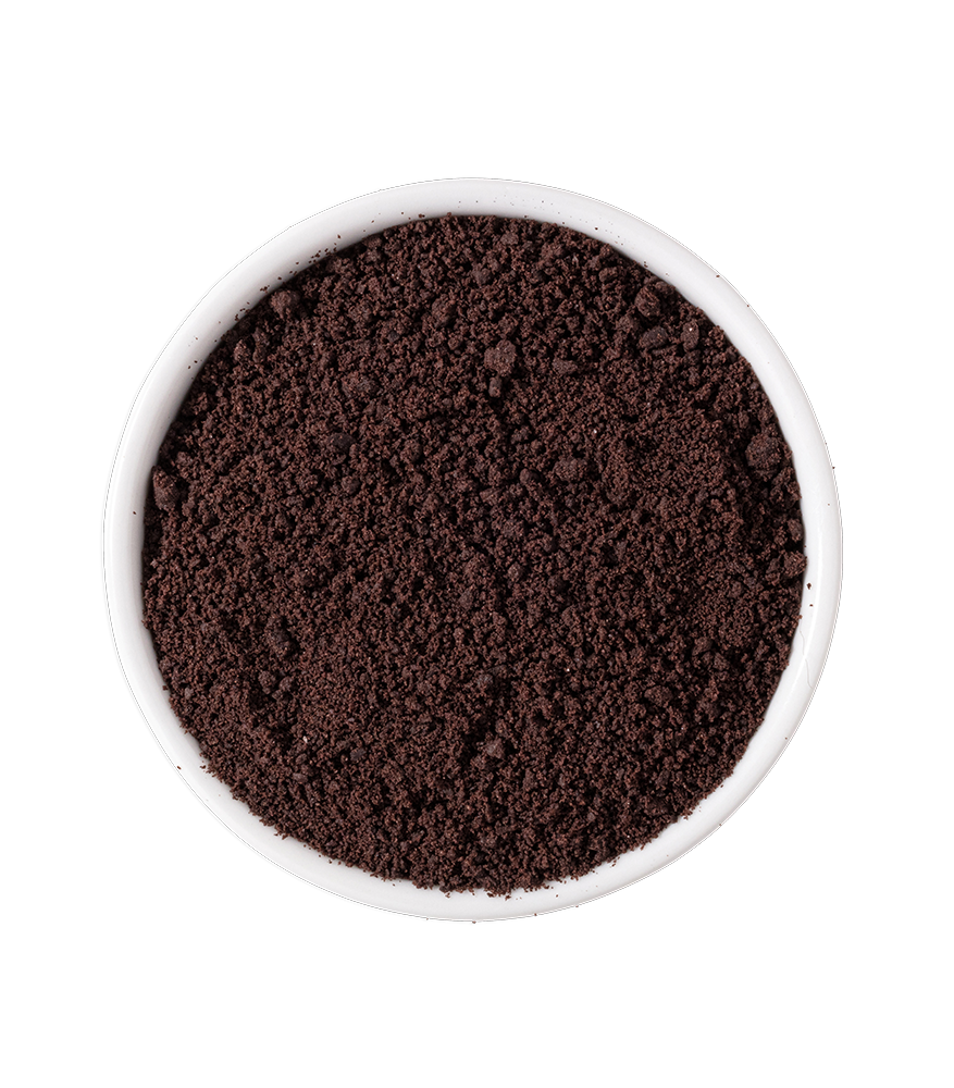 A white bowl filled with finely ground coffee or cocoa powder, placed on a black background.