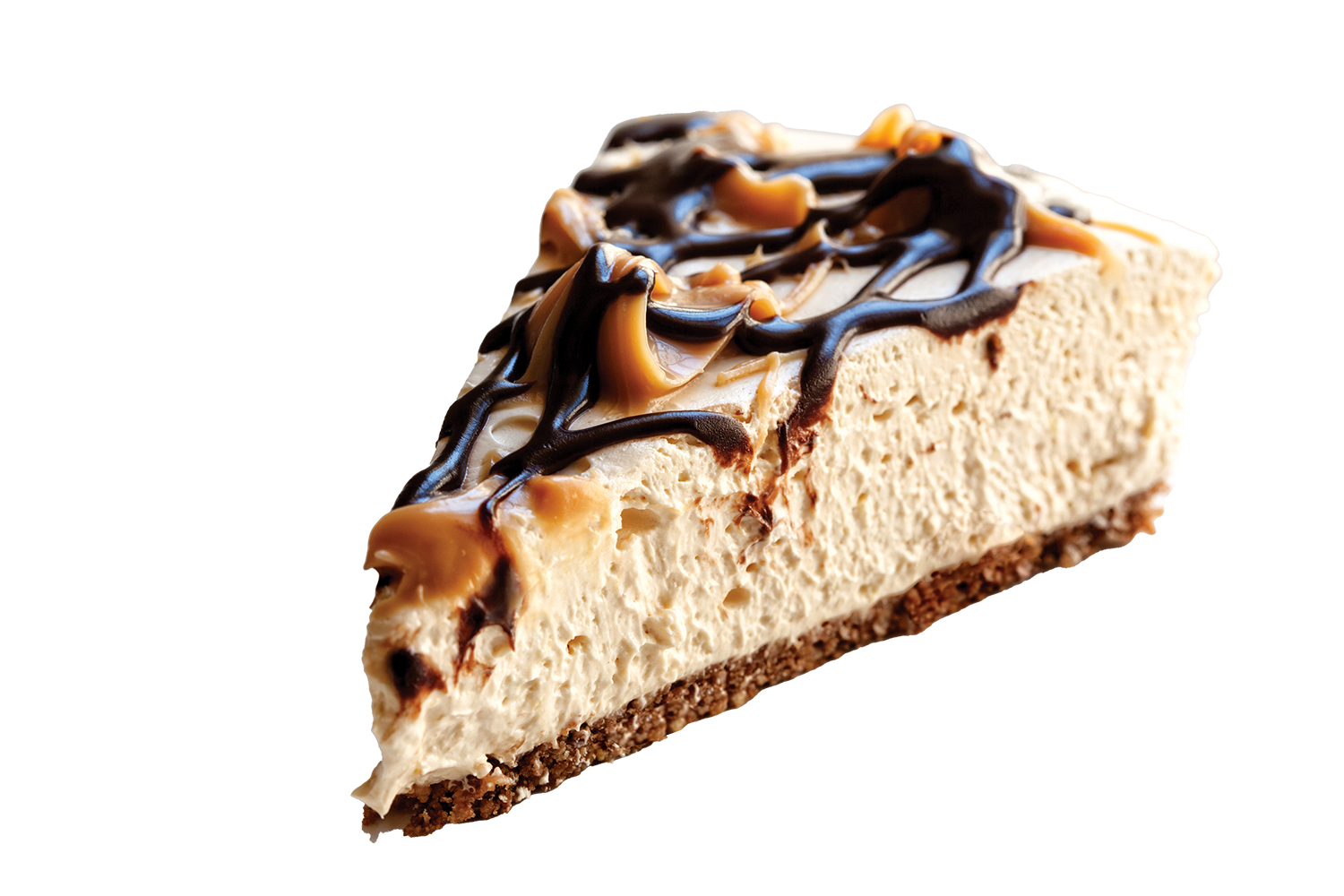 Slice of cheesecake topped with caramel and chocolate drizzle.