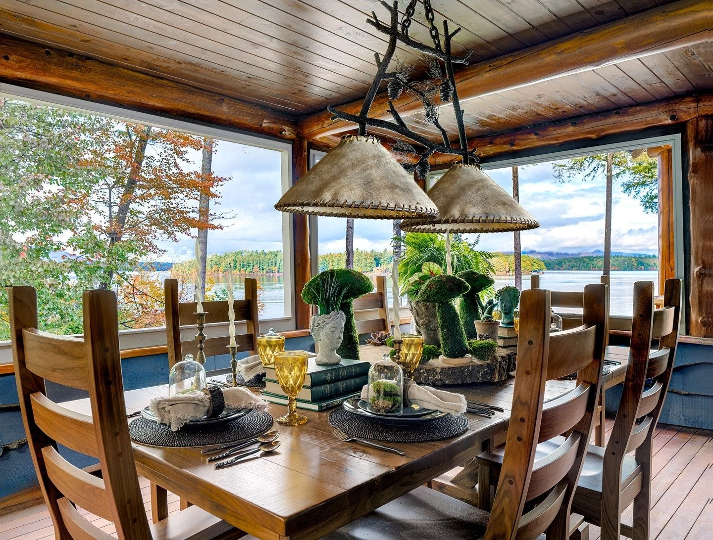 The joy of elevated lakeside living on Lake Winnipesaukee 🏞️ We redesigned this Meredith, NH home, bringing thoughtful, curated touches to every corner, including this stunning screened porch where long lake days transition into slow, memorable meal
