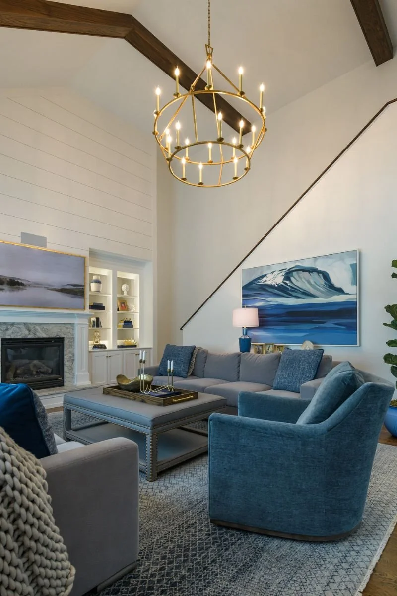 Vaulted ceiling with exposed beams in the living room with rich blue color palate