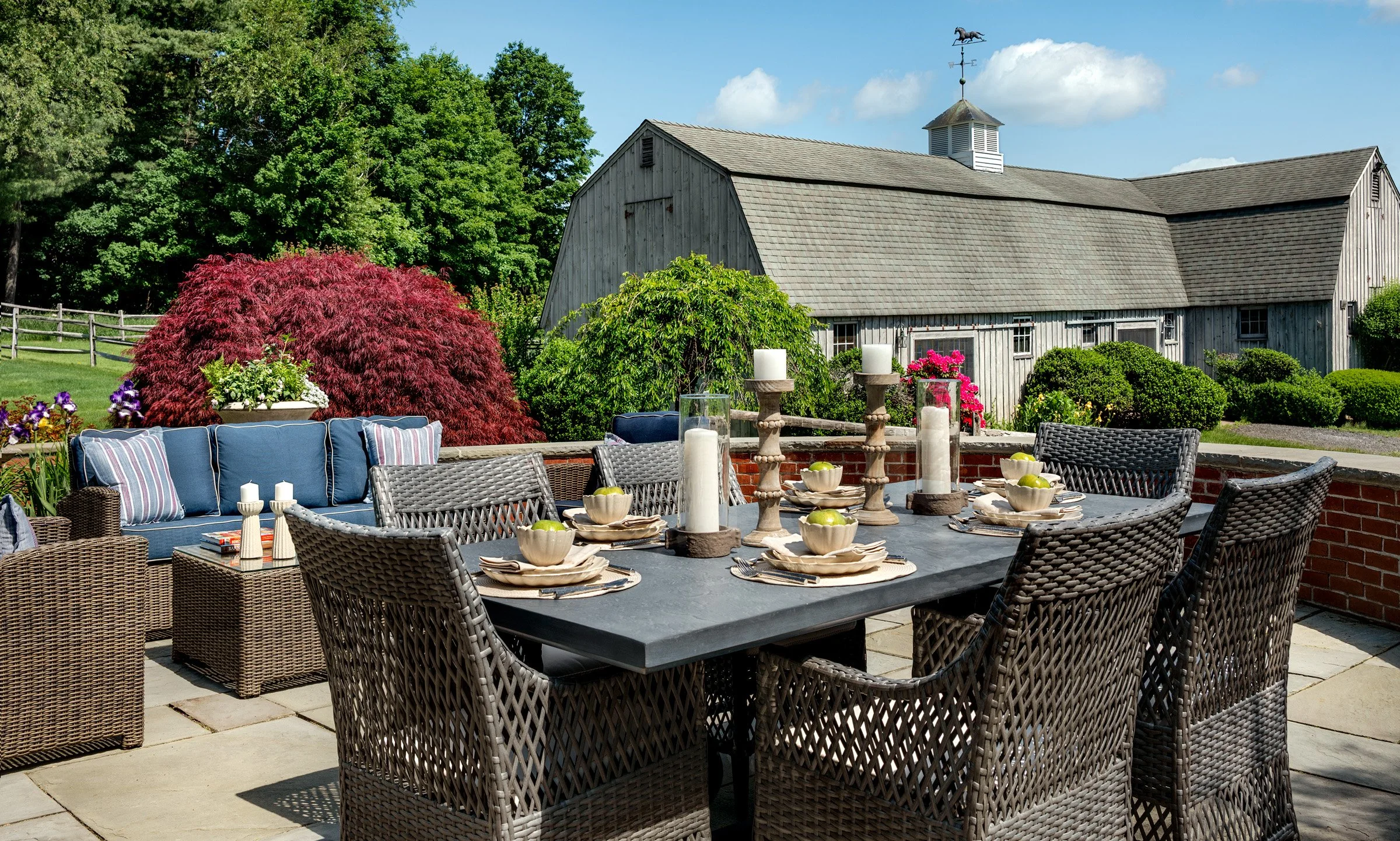 Outdoor dining with a view of the barn