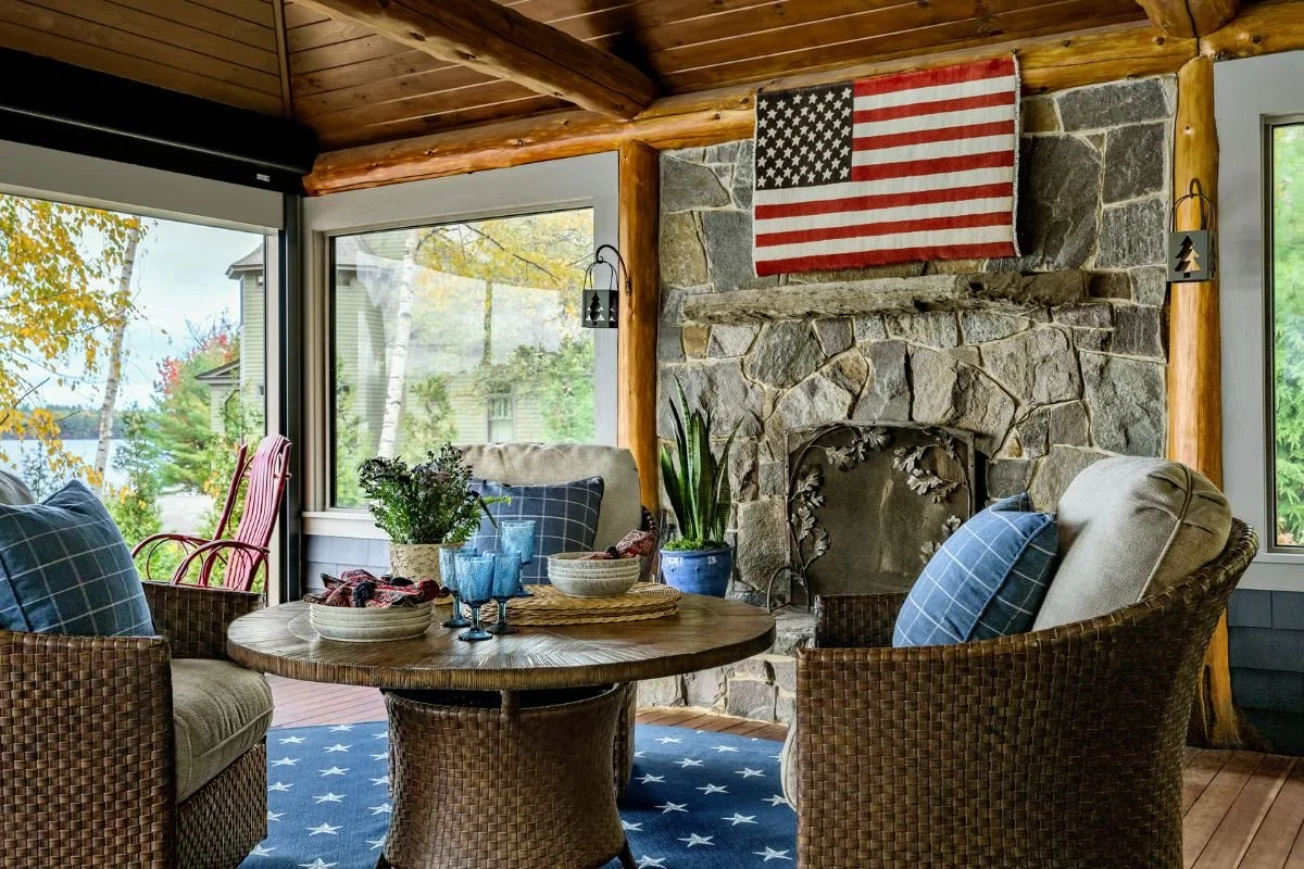 Americana rustic 3 season porch with field stone fireplace