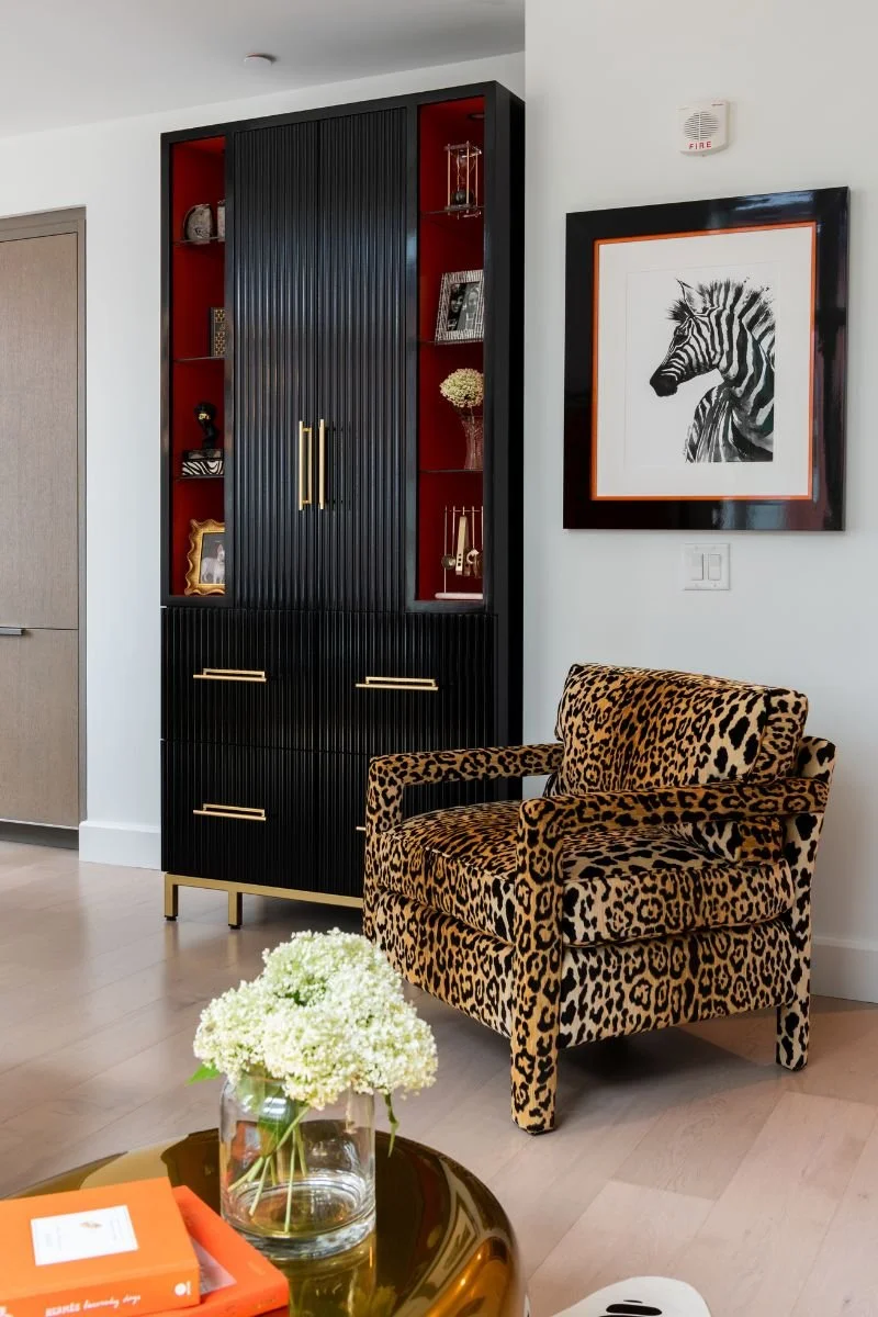 Black elegant bar cabinet, leopard print upholstered chair