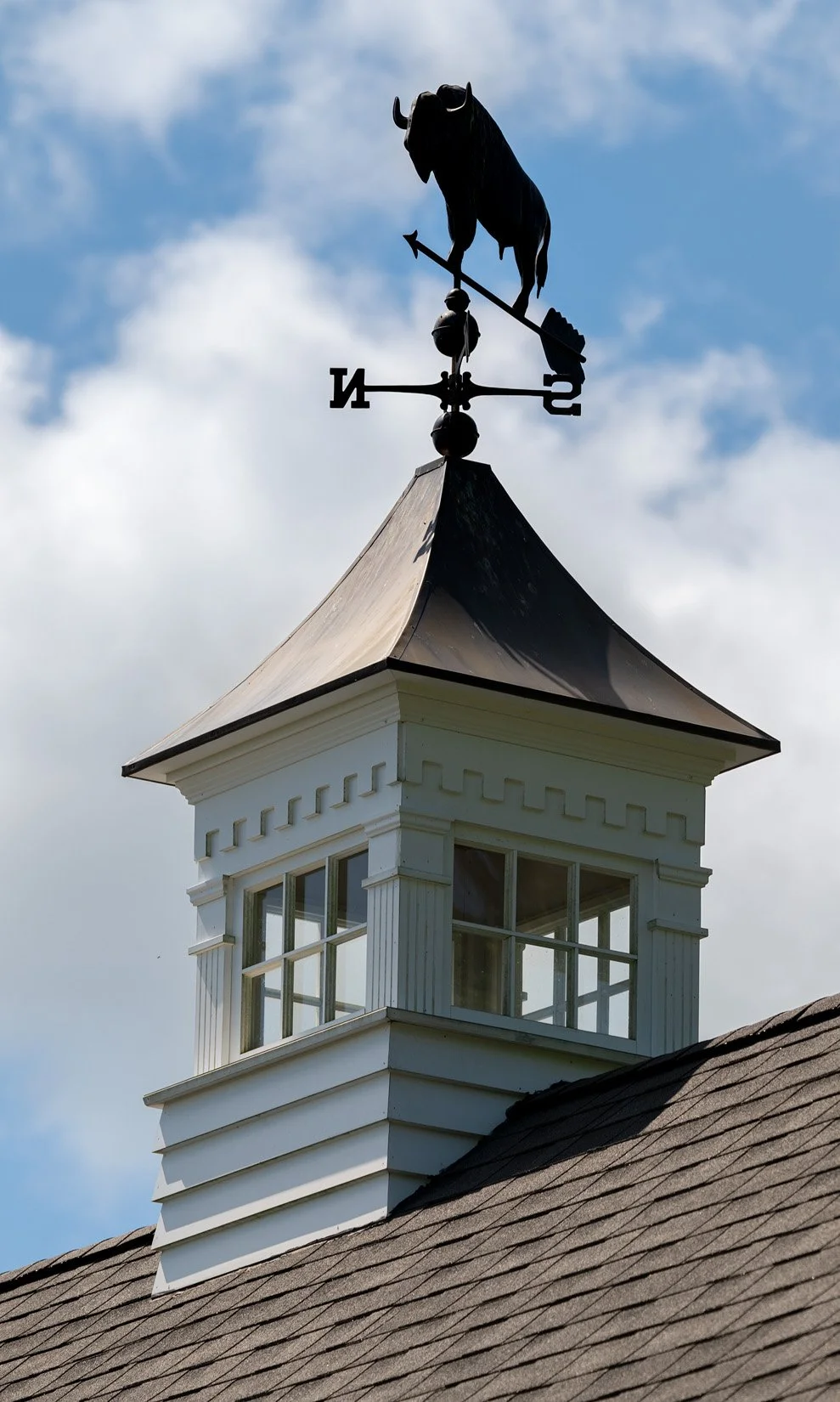 A custom buffalo weathervane gives a nod to our client's hometown.