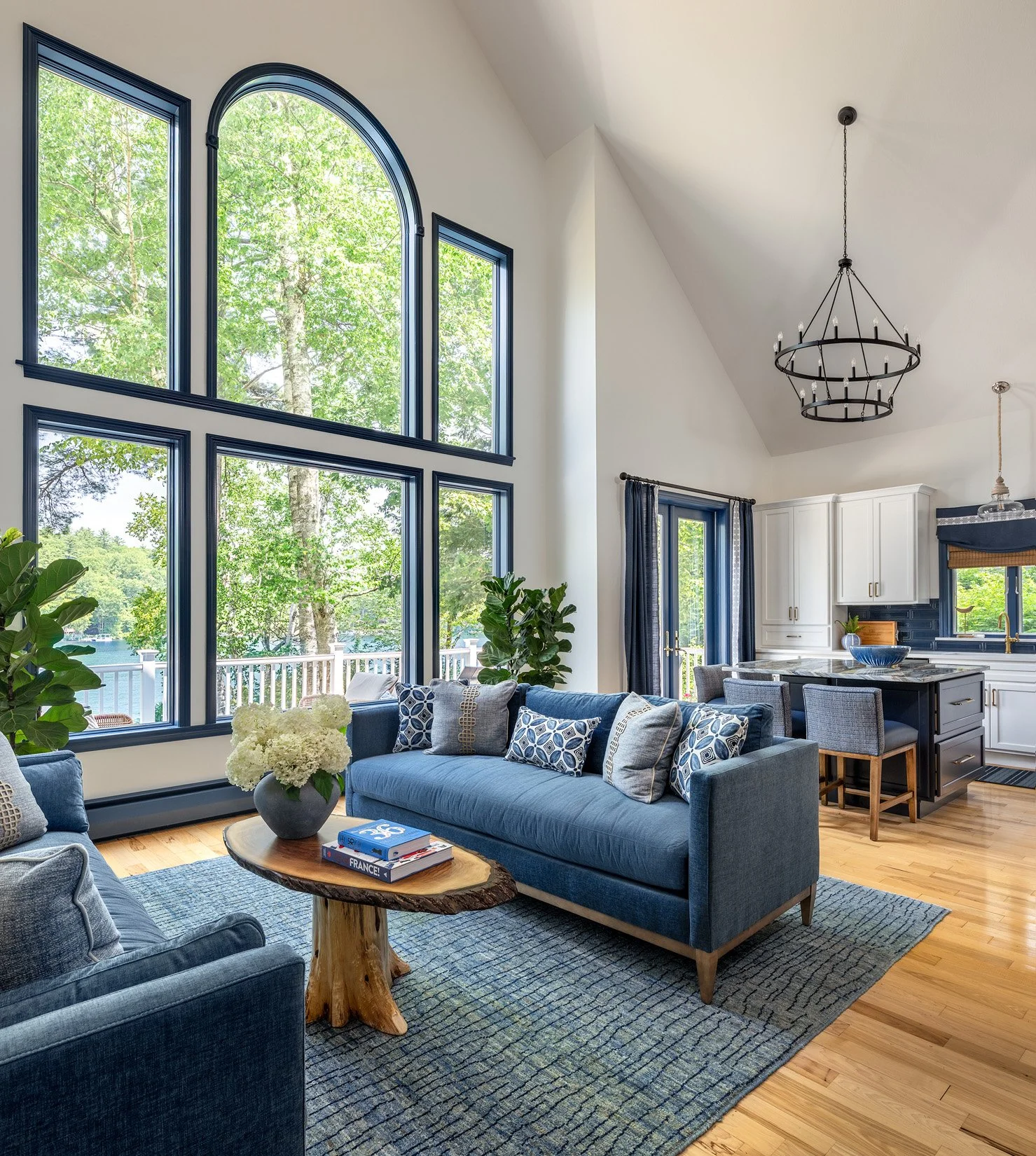 Expansive windows and views of Lake Winnipesaukee from this newly designed living room