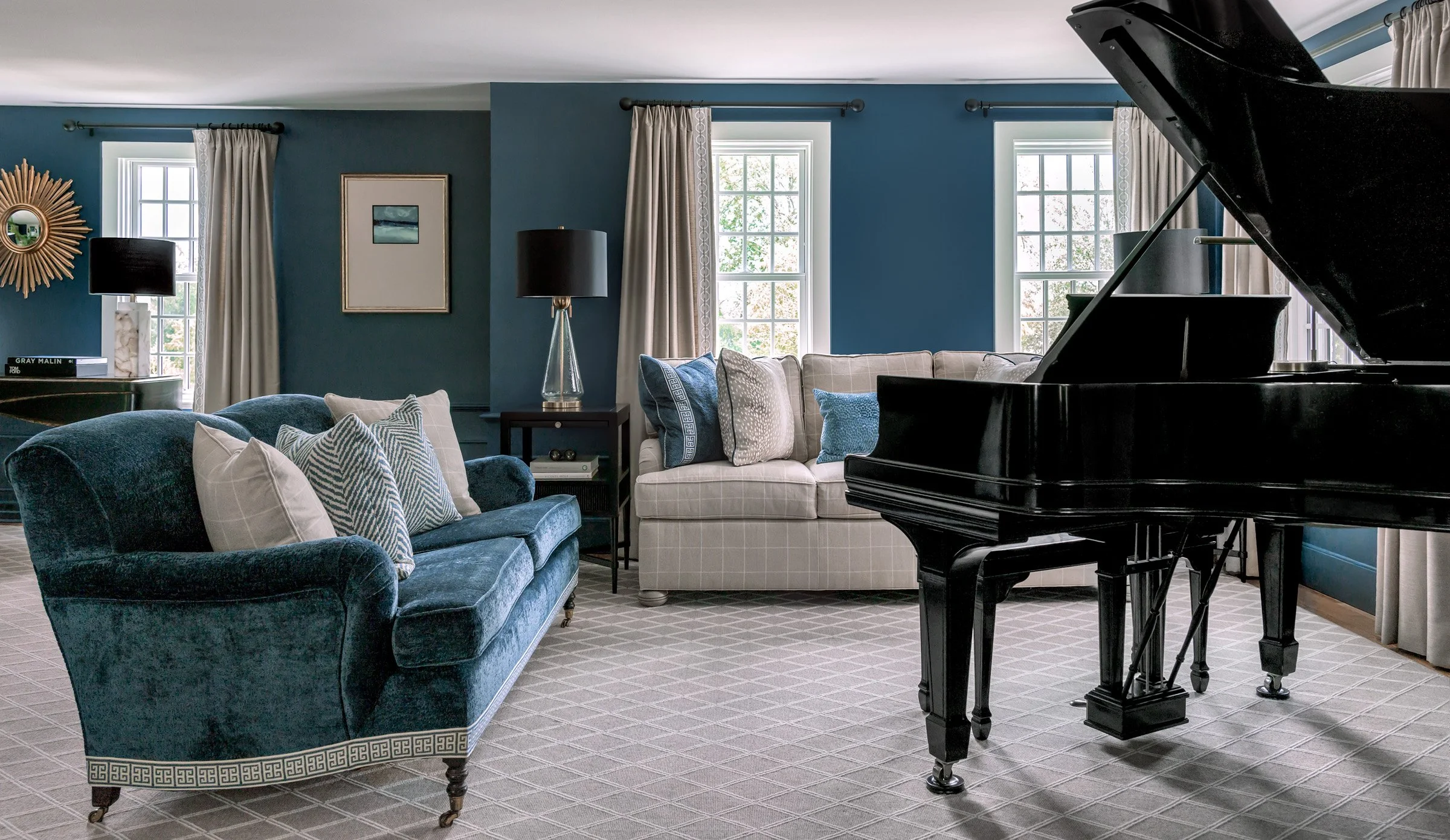 Comfortable custom seating around a beautiful grand piano.
