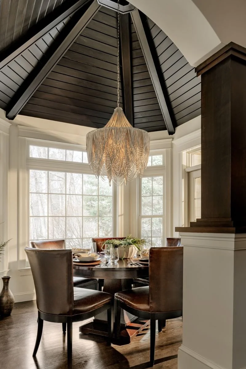 Formal dining room in turret space with organic lighting to soften the space