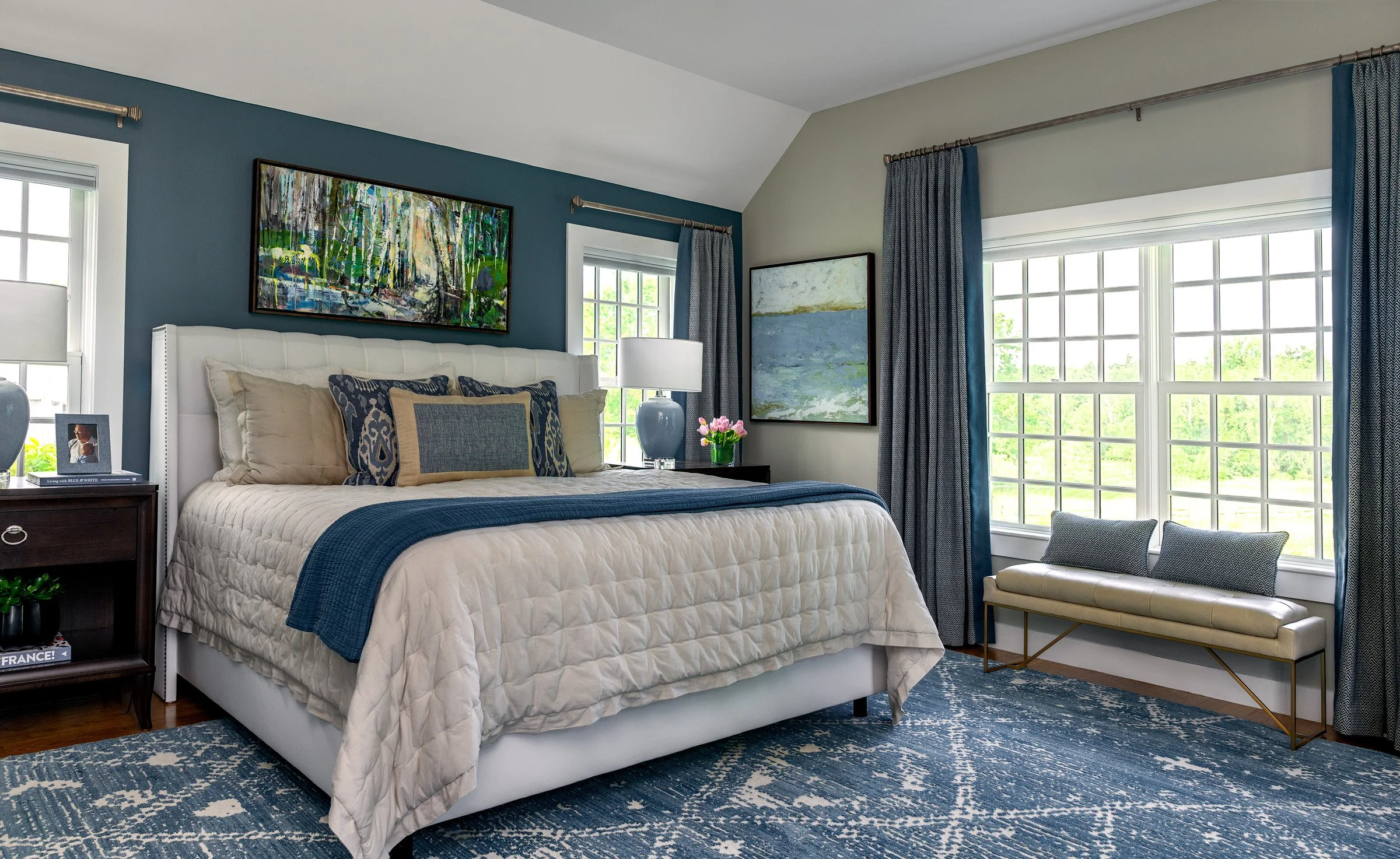 A primary bedroom in beautiful blues.