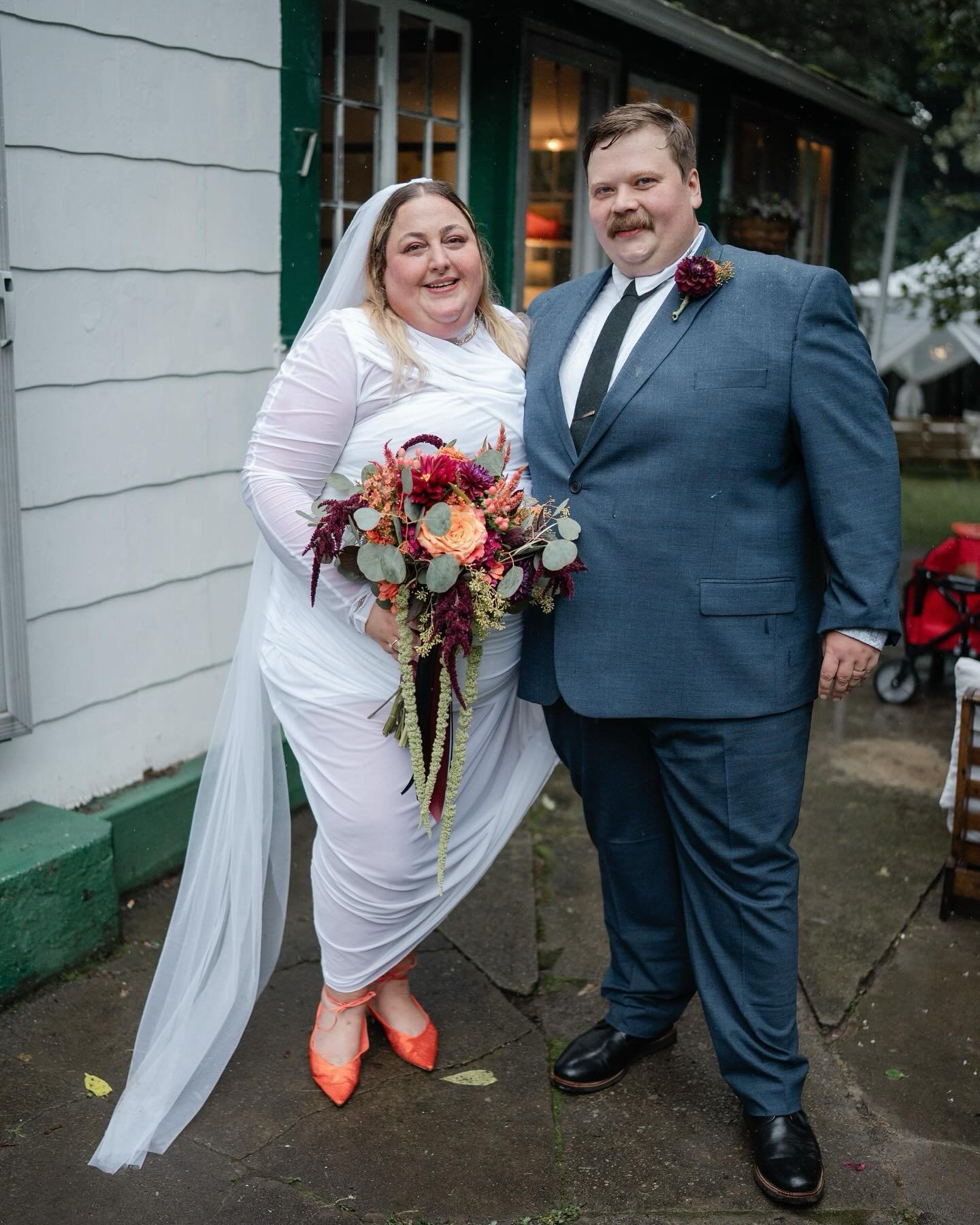 Sydney and Lou&rsquo;s backyard wedding was nothing short of magical, even as the rain came down. Their love was undeniable, and the sense of community was strong as everyone chipped in to make sure the day went off without a hitch. The rings were cl
