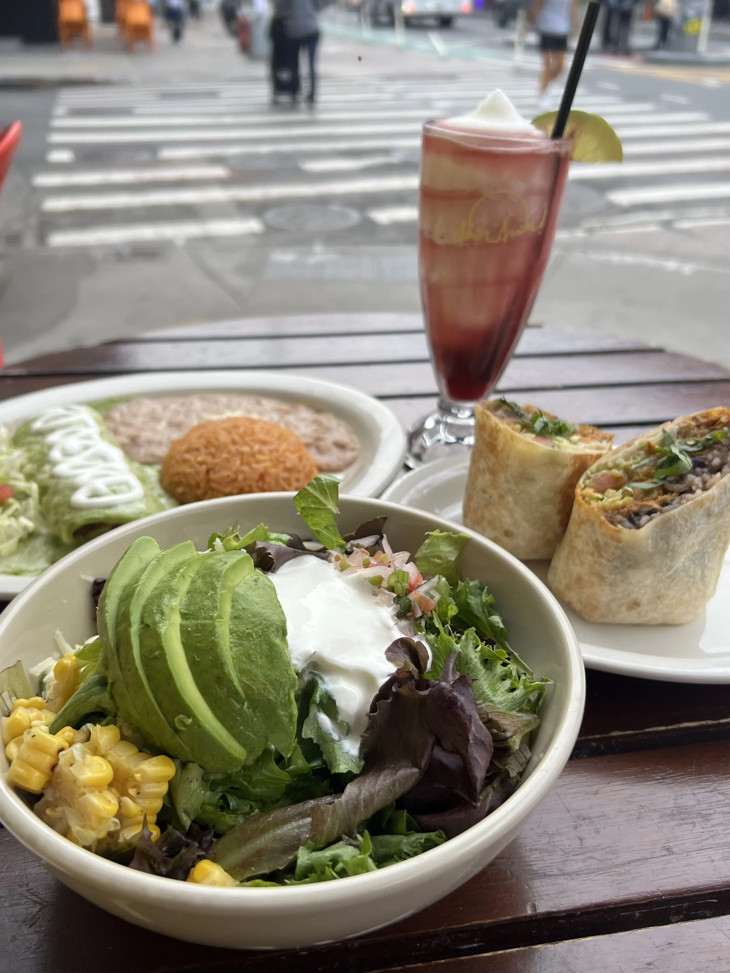 $15 lunch special. Healthy burrito bowl in the foreground, enchilada, burrito, and margarita in the background
