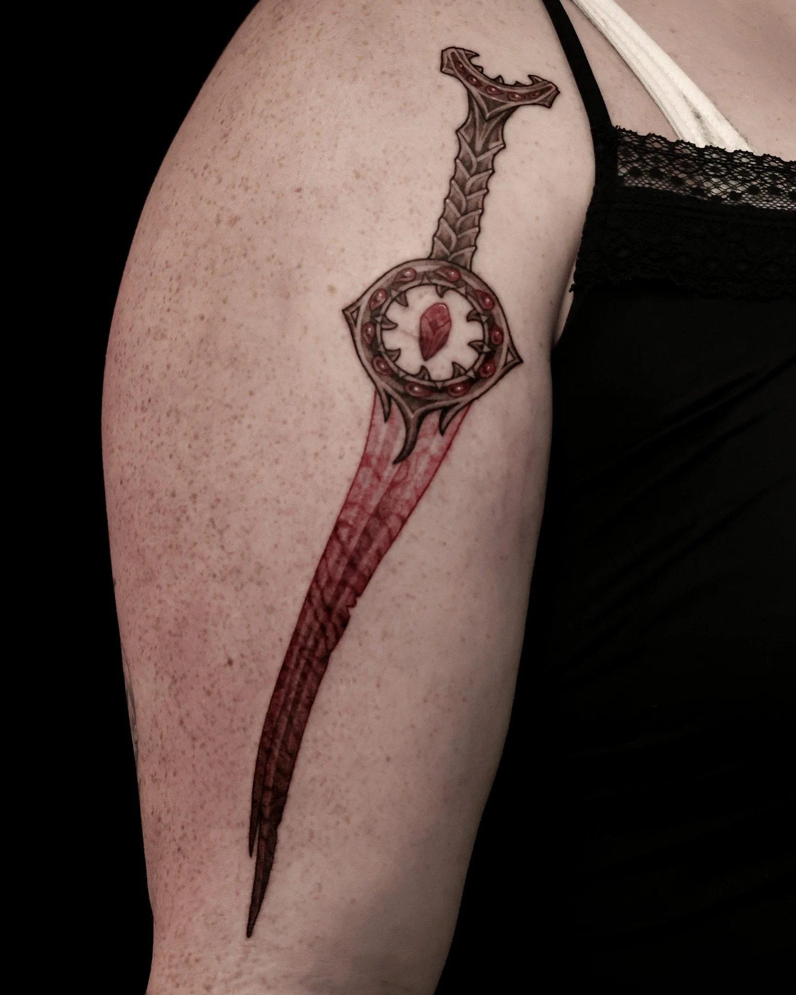 Bloodthirst from Baldur's Gate 3 🗡I don't typically do a lot of colour, but red has been trending for me lately, and I love BG3! We added some marbling in the blade to resemble Orin's changeling skin. 🖤

✦
✦
#canadatattoo #kamloopstattoo #blackwork