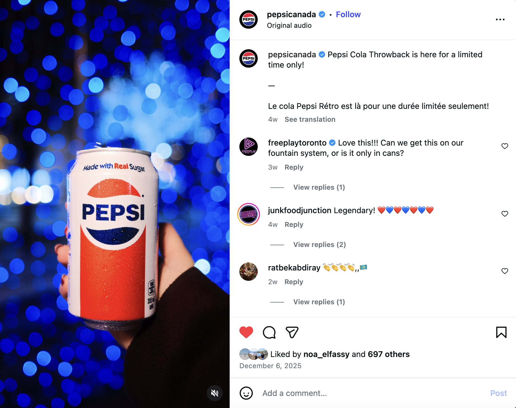 A person holding a Pepsi soda can with a background of blue bokeh lights.