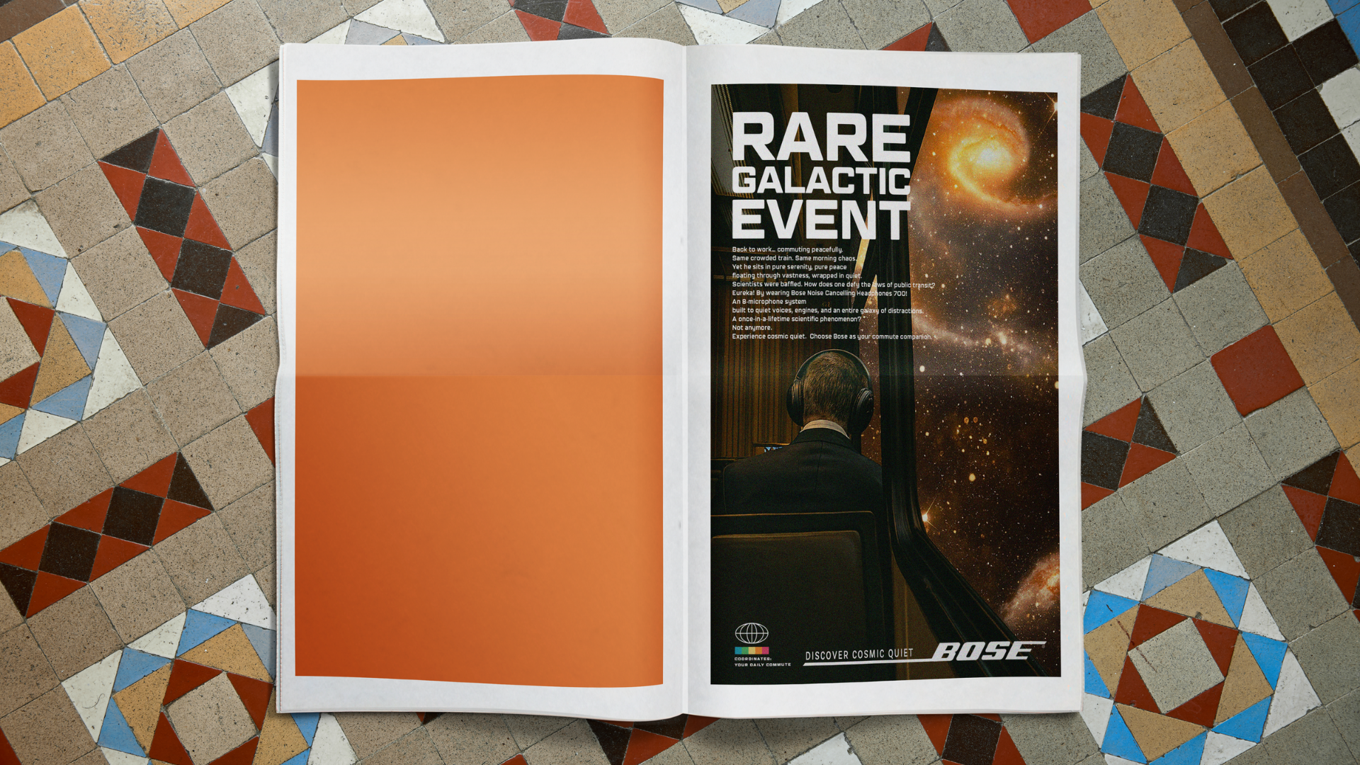 An open magazine on a patterned tile floor, with the right page showing an advertisement for a rare galactic event featuring a person in headphones looking out an airplane window at a galaxy in space. The left page is blank with a gradient orange background.